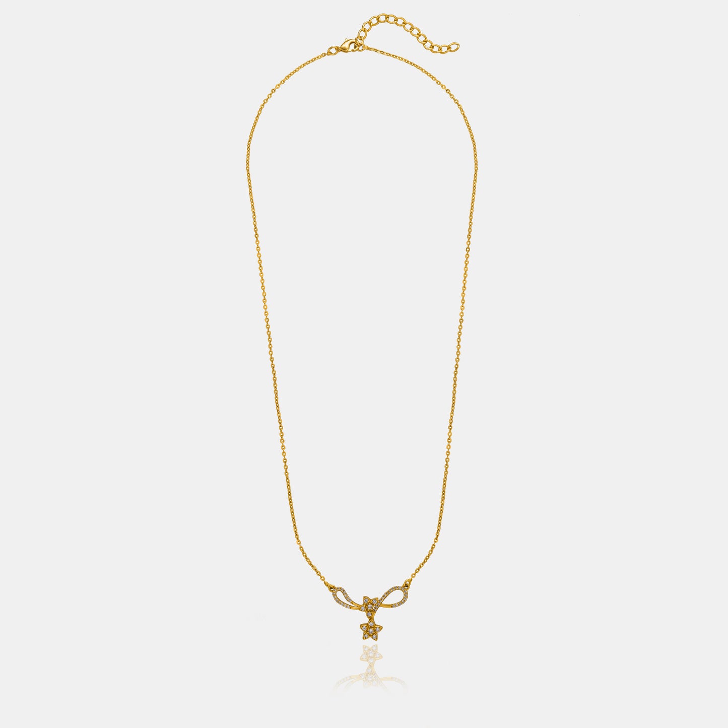 golden necklace with a diamond star on it