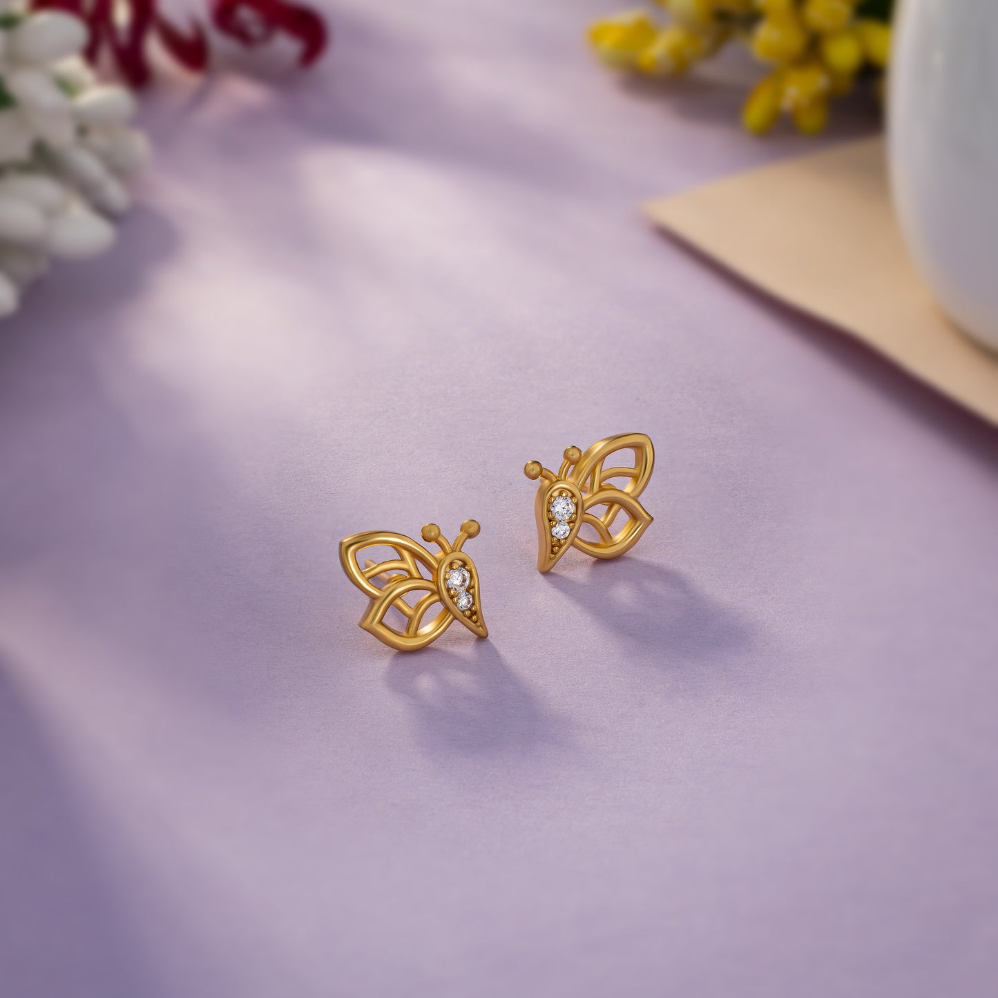 butterfly stud earrings made of golden and diamonds