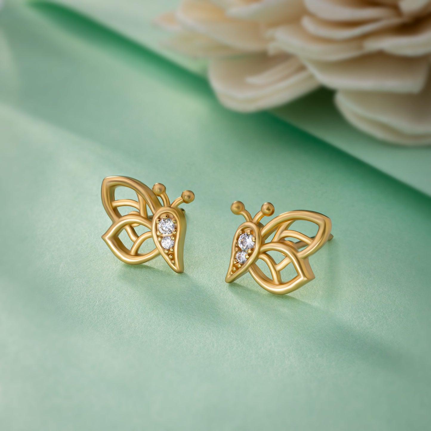 butterfly stud earrings made of golden and diamonds