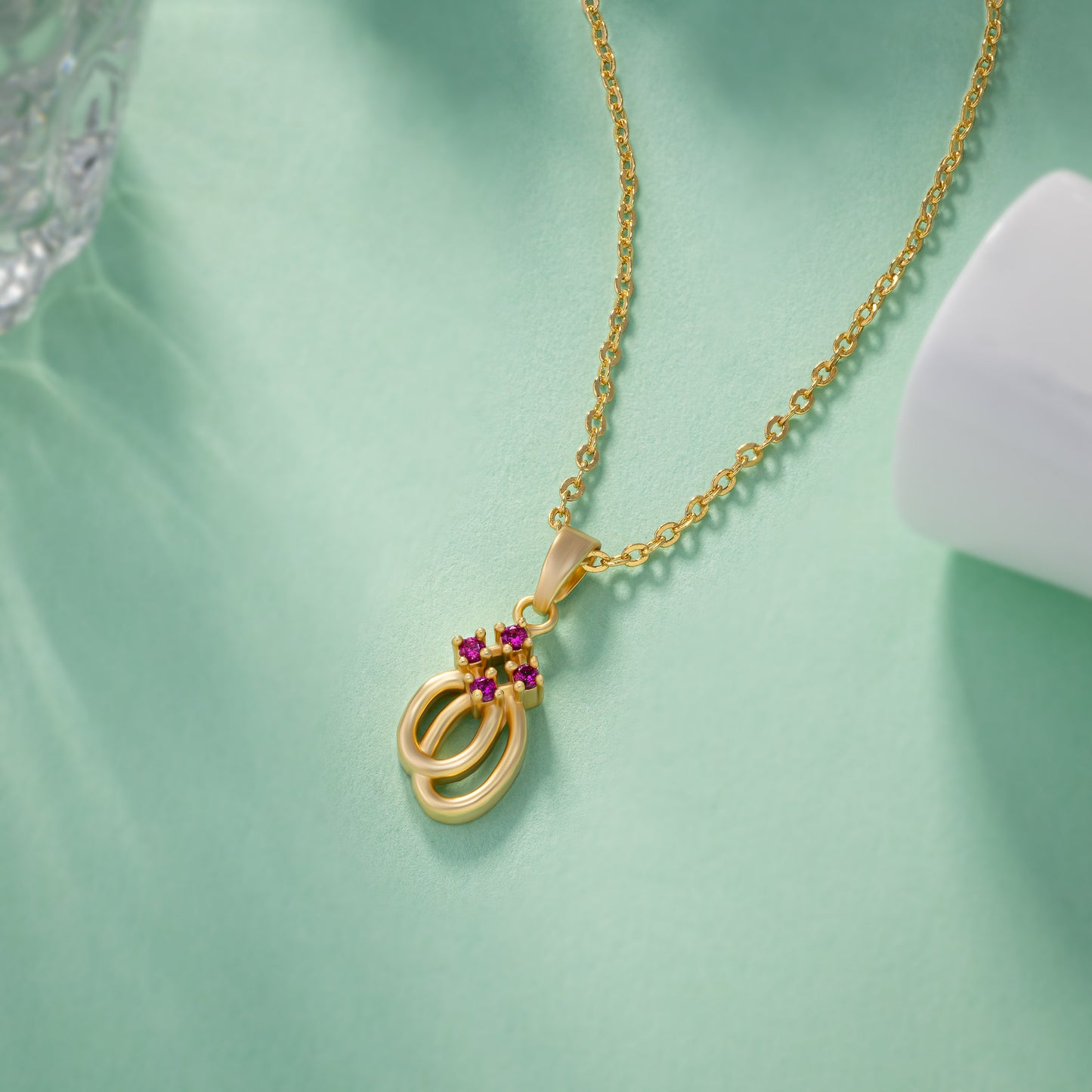 golden necklace with a diamond pendant