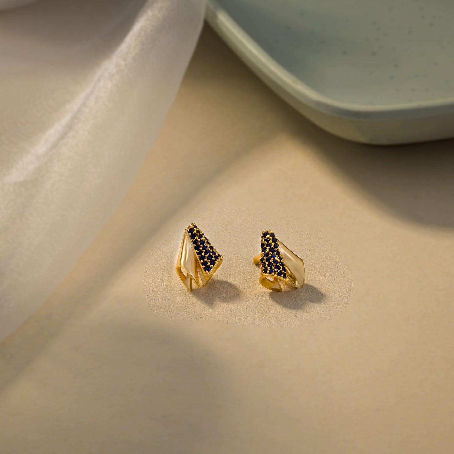 the golden and sapphire earrings