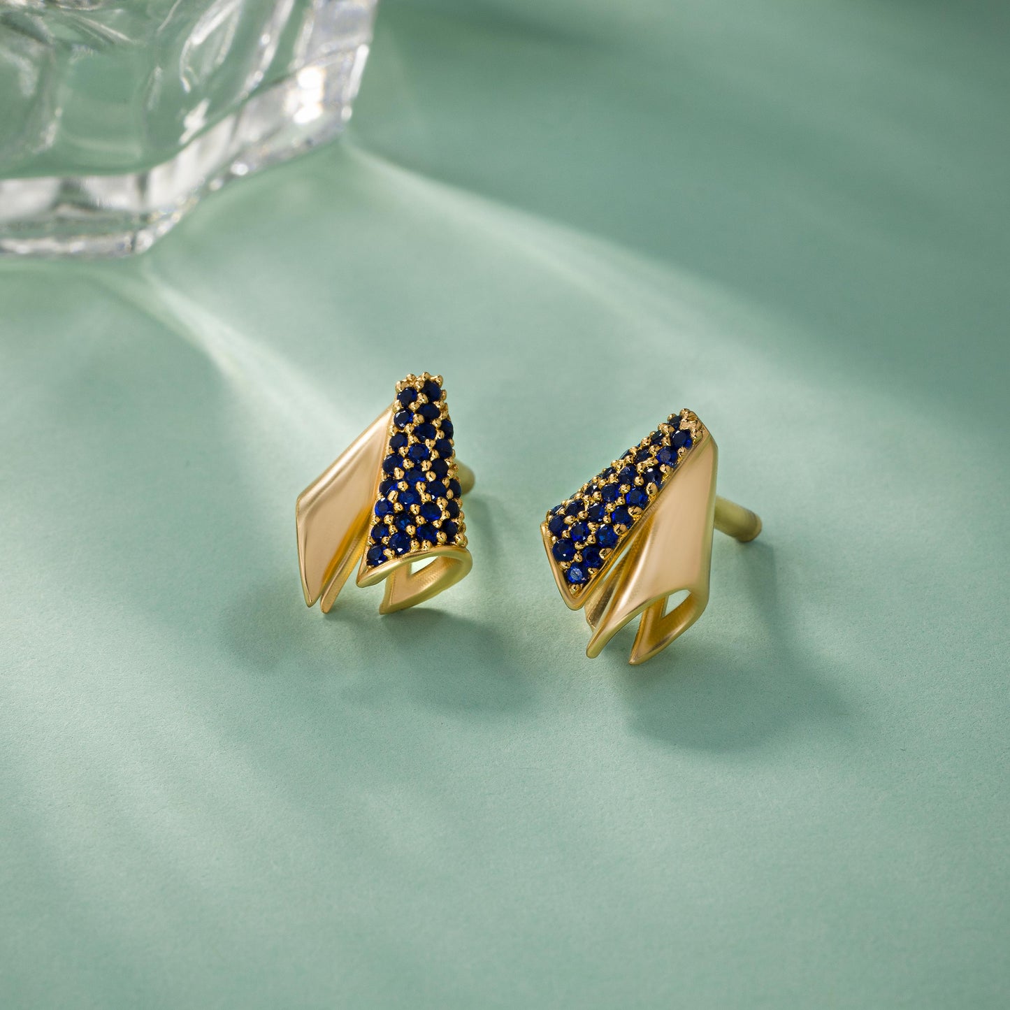 the golden and sapphire earrings