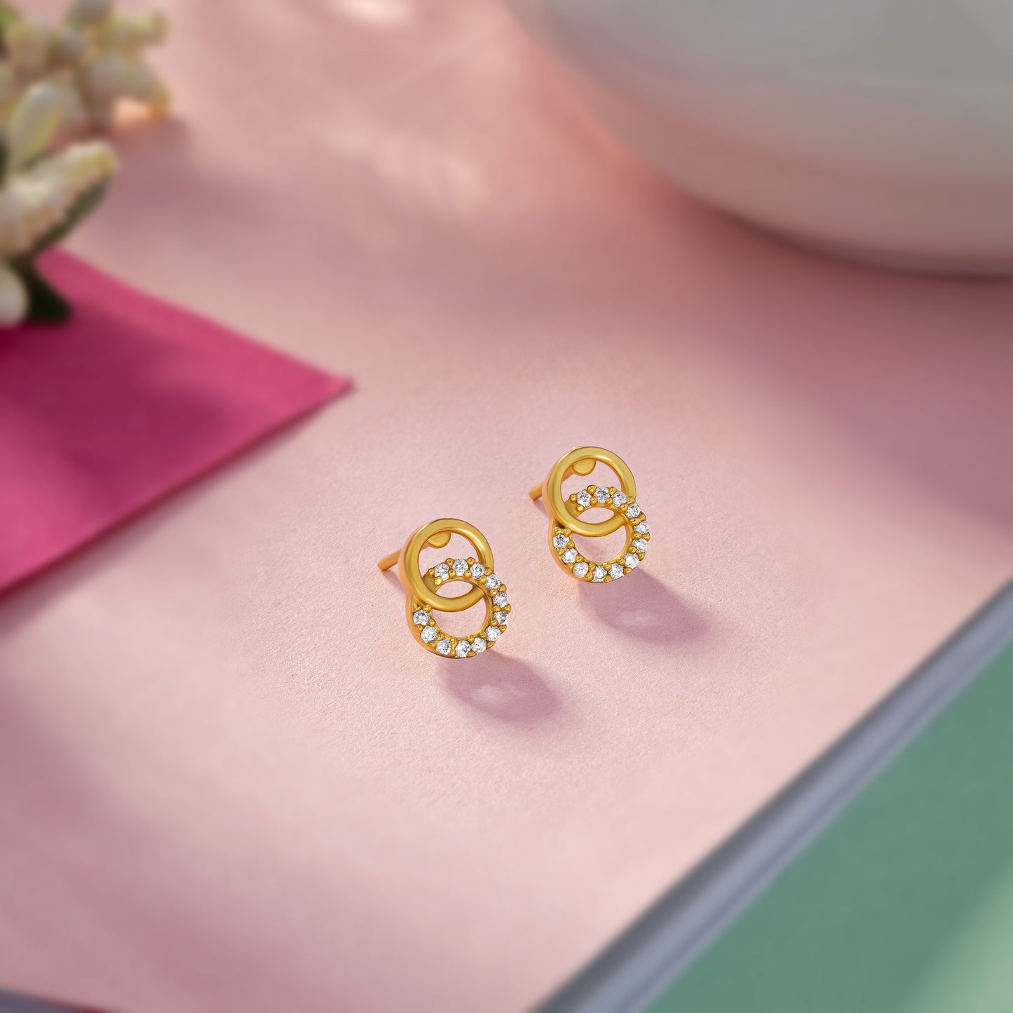 pair of golden earrings with diamonds