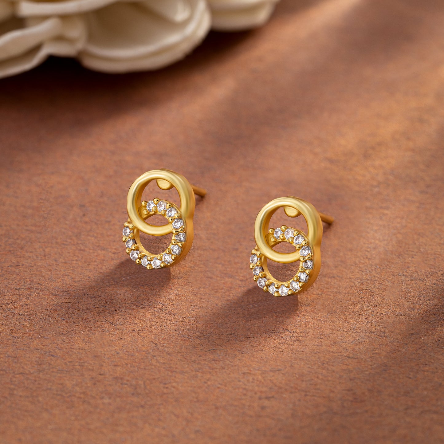 pair of golden earrings with diamonds