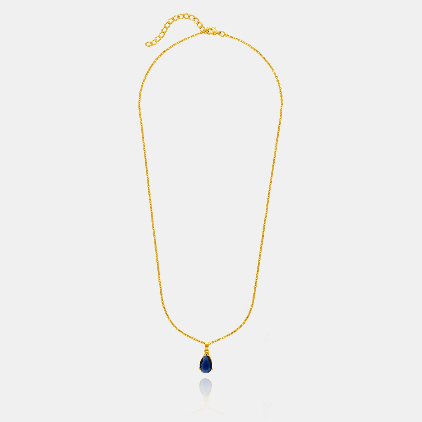 golden necklace with a small blue stone