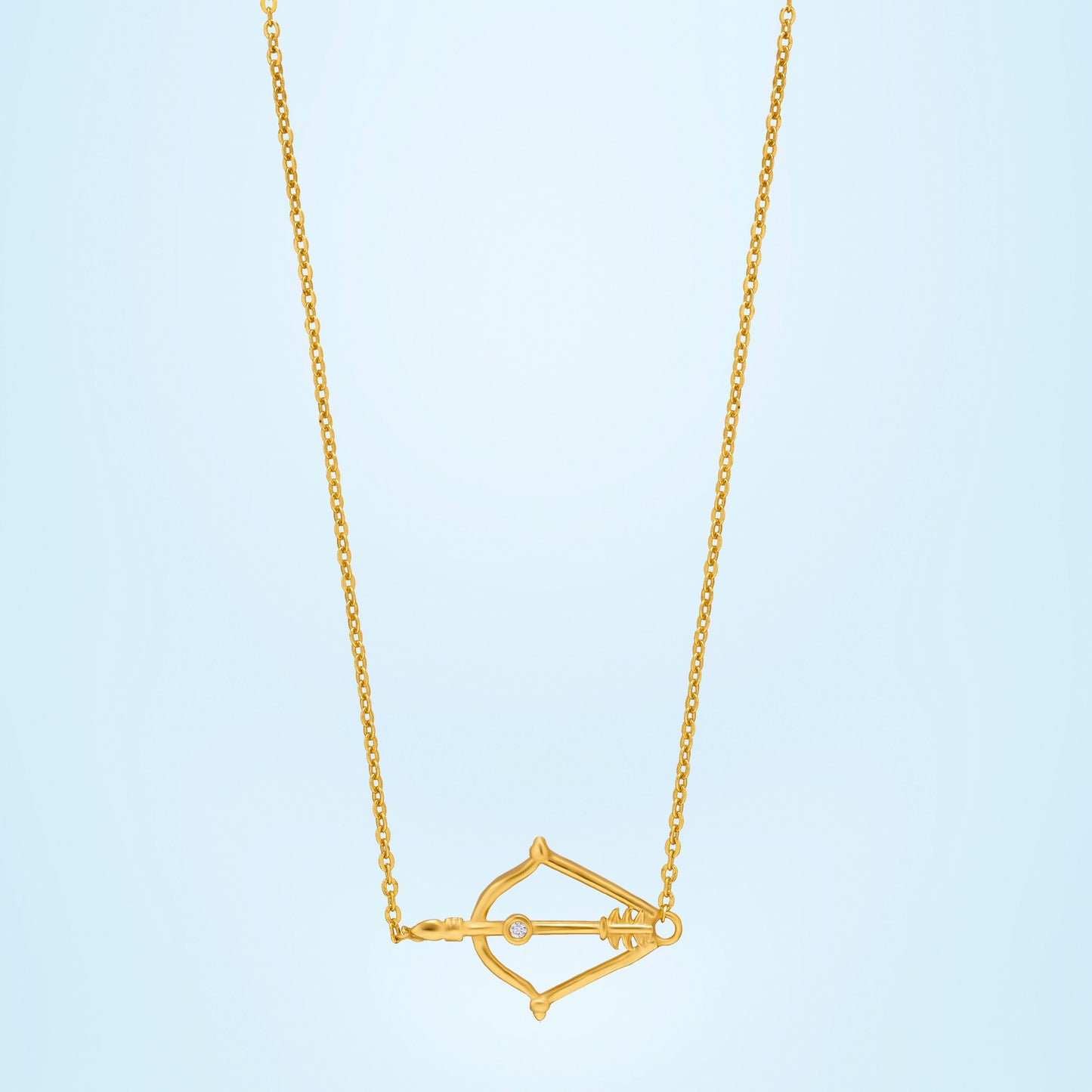 golden necklace with a small arrow on it