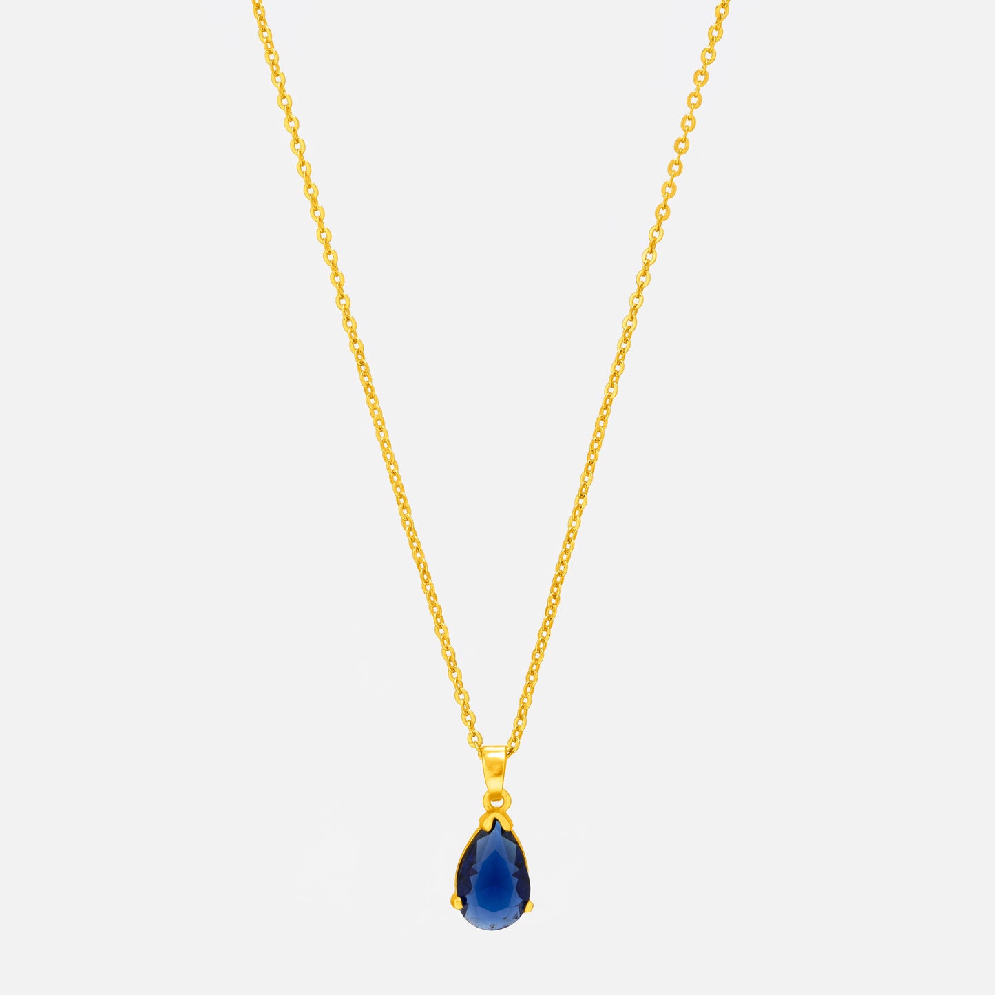 golden necklace with a small blue stone