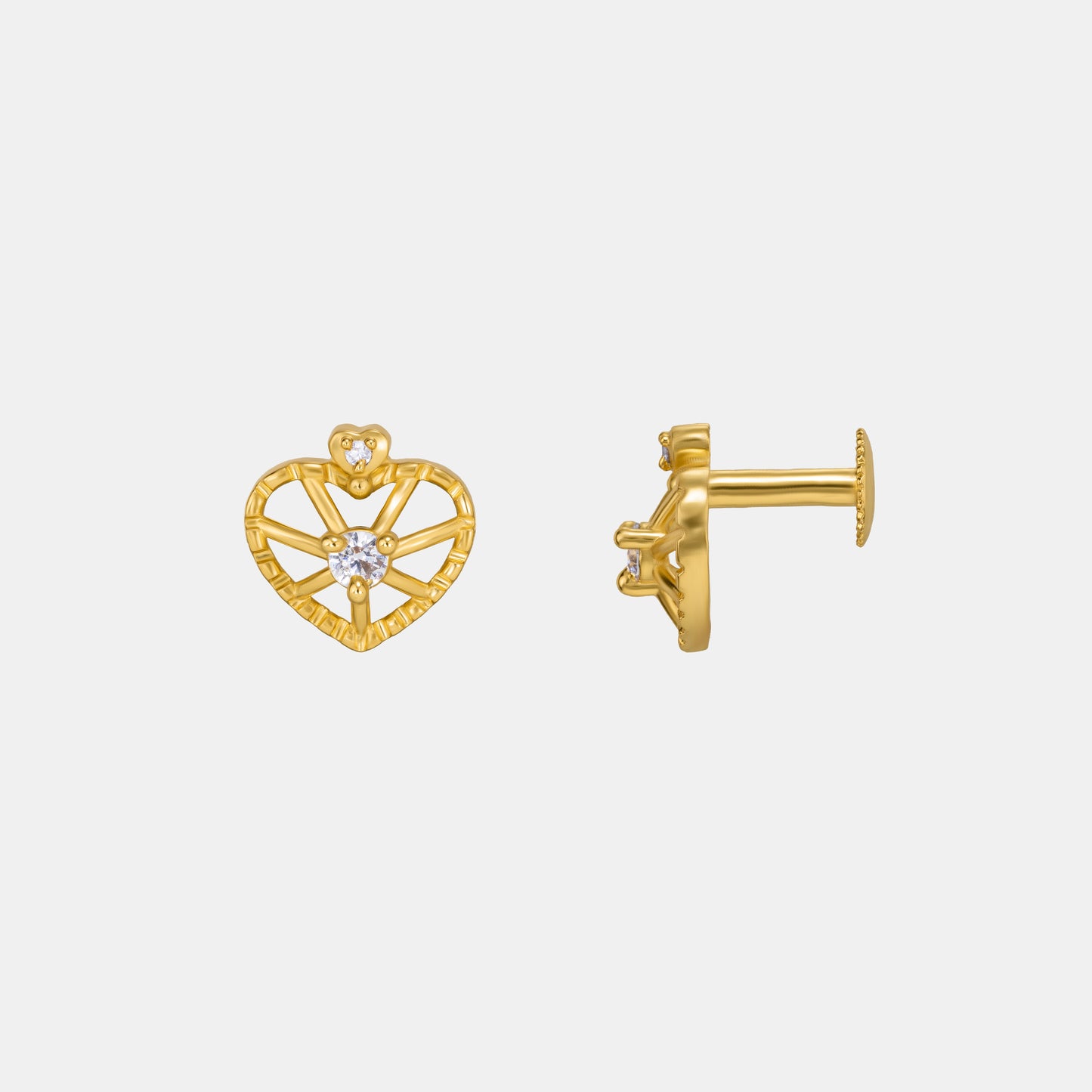 pair of golden earrings with a heart shaped diamond