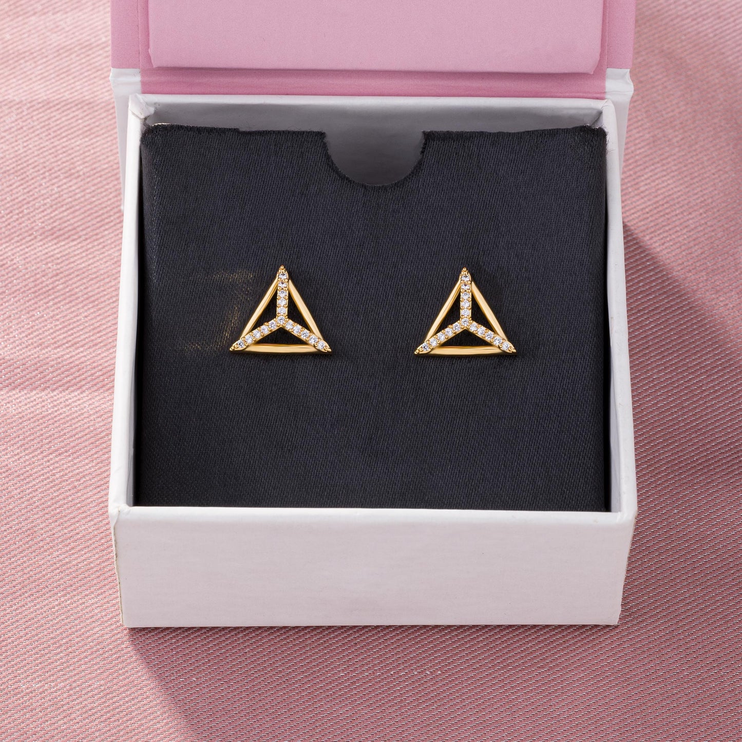 pair of golden earrings with diamonds