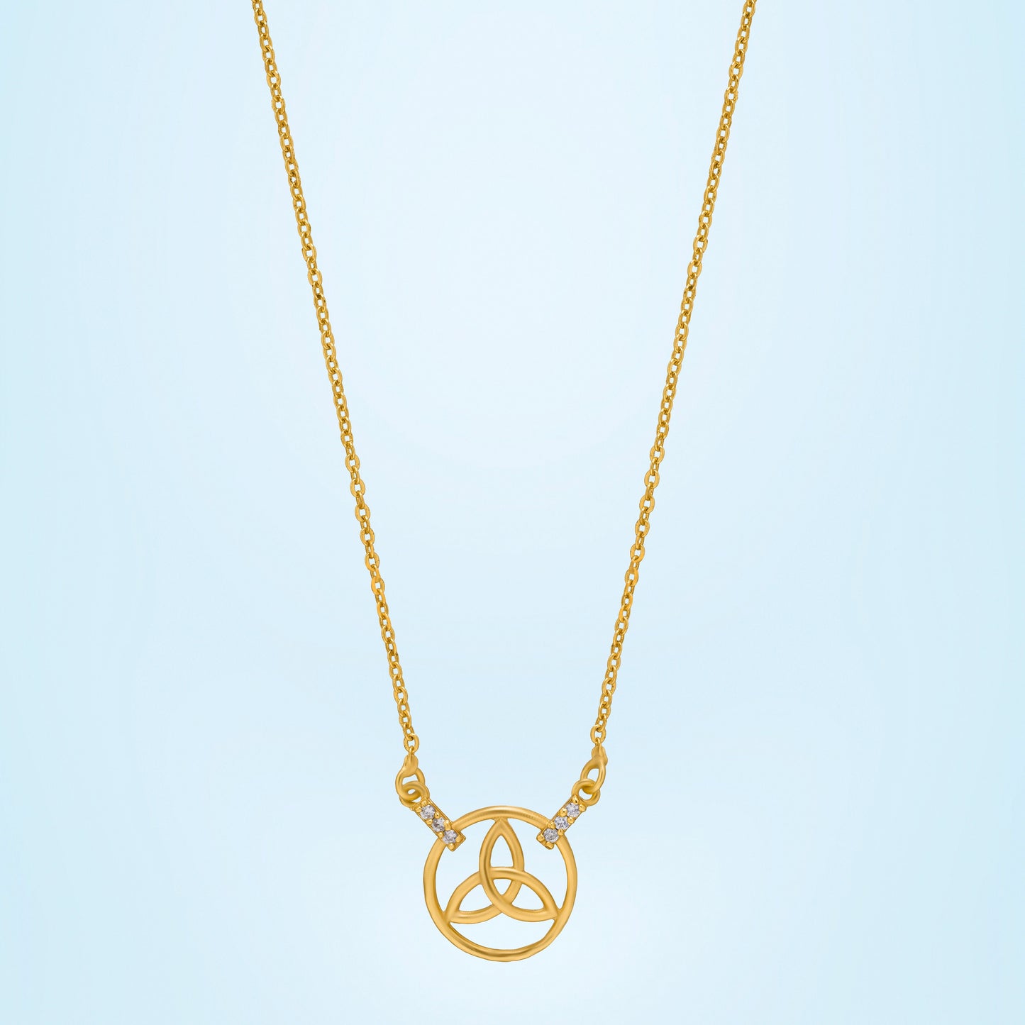 golden necklace with a small diamond on the front