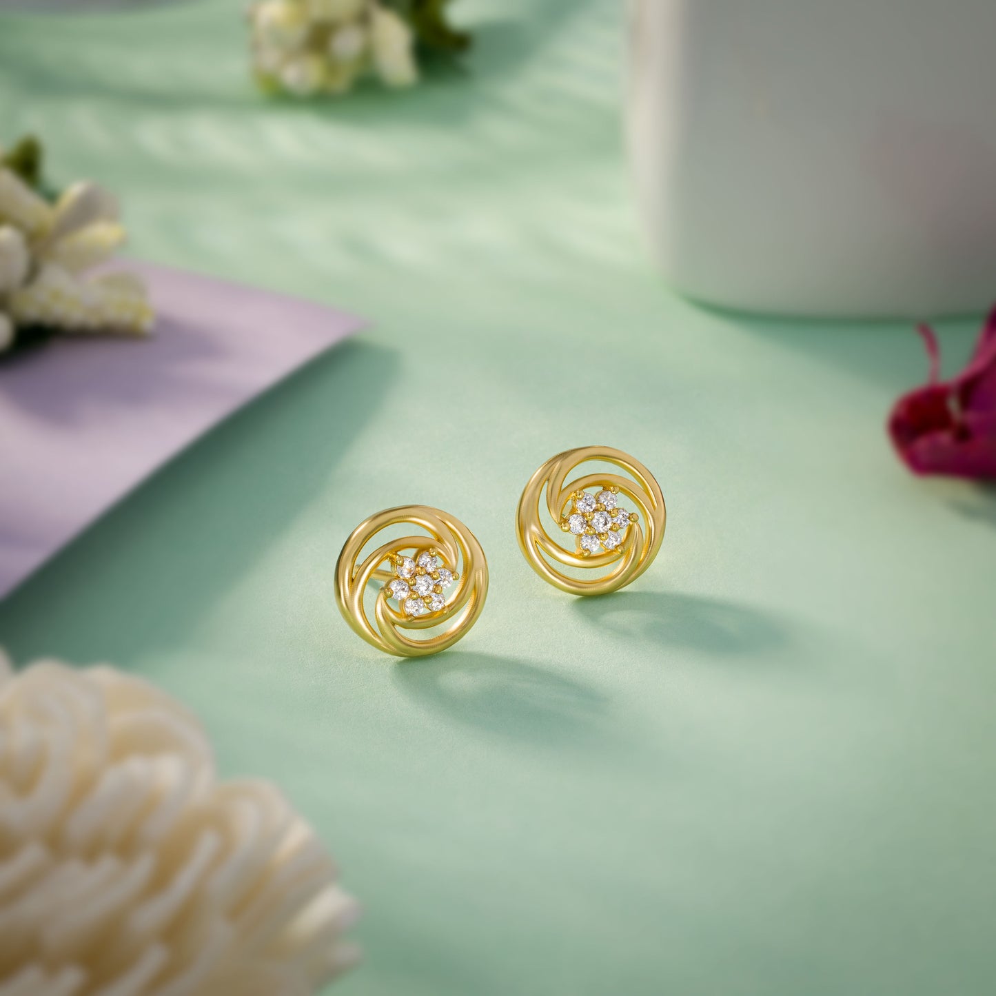 pair of golden earrings with diamonds