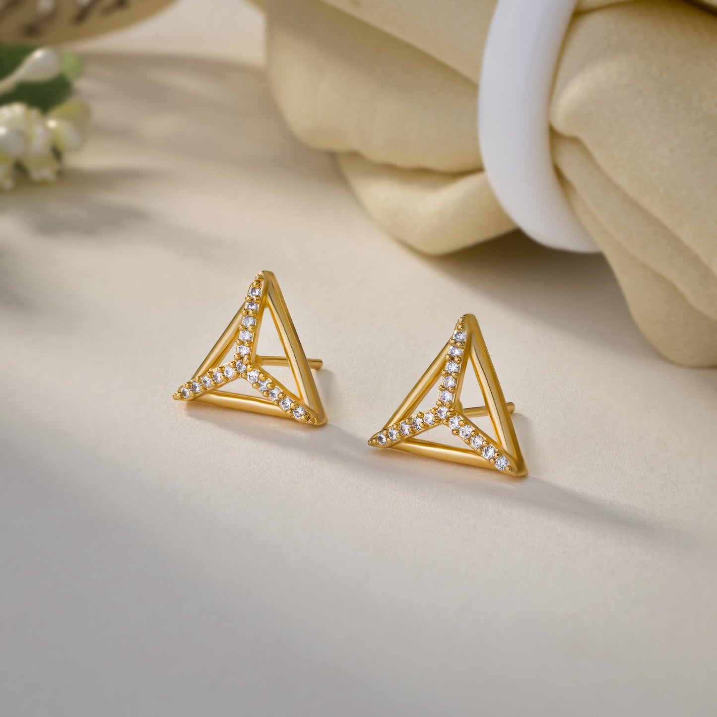 pair of golden earrings with diamonds