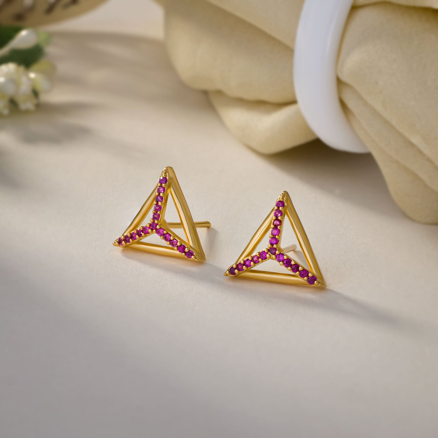 pair of golden earrings with diamonds