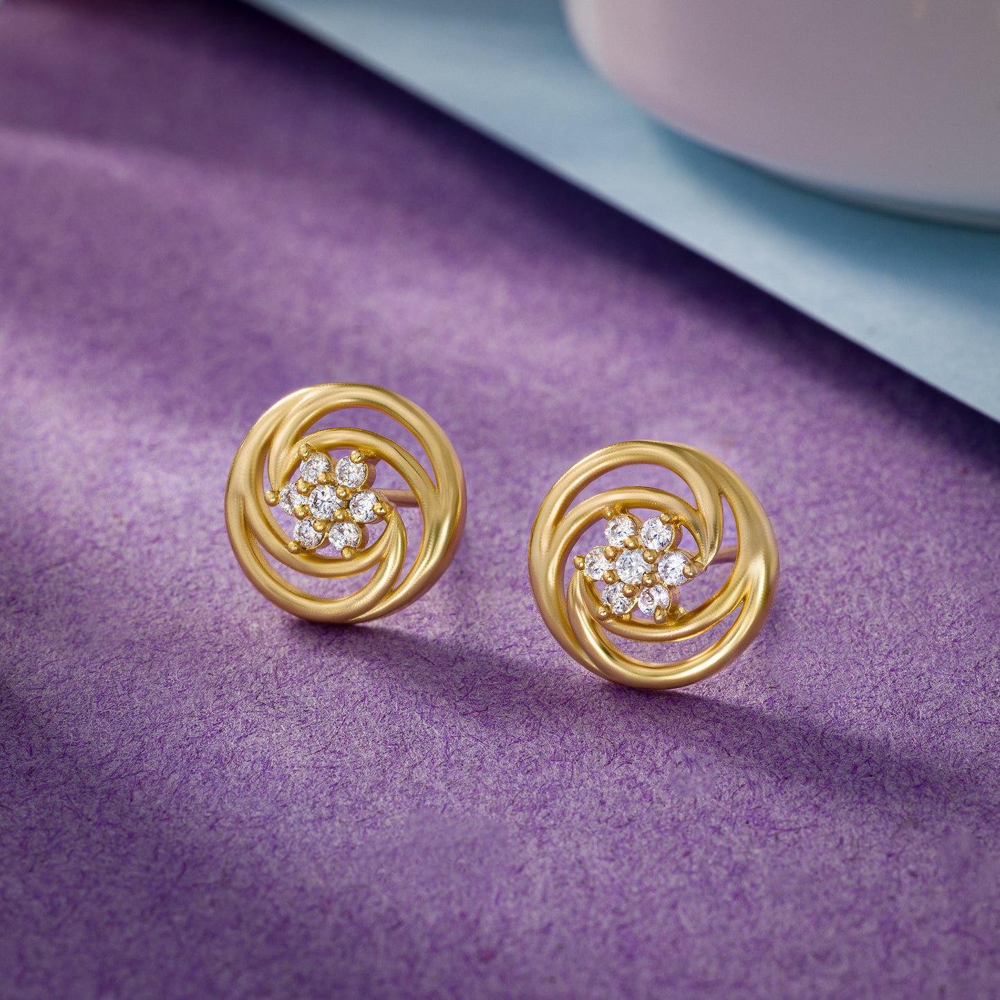 pair of golden earrings with diamonds