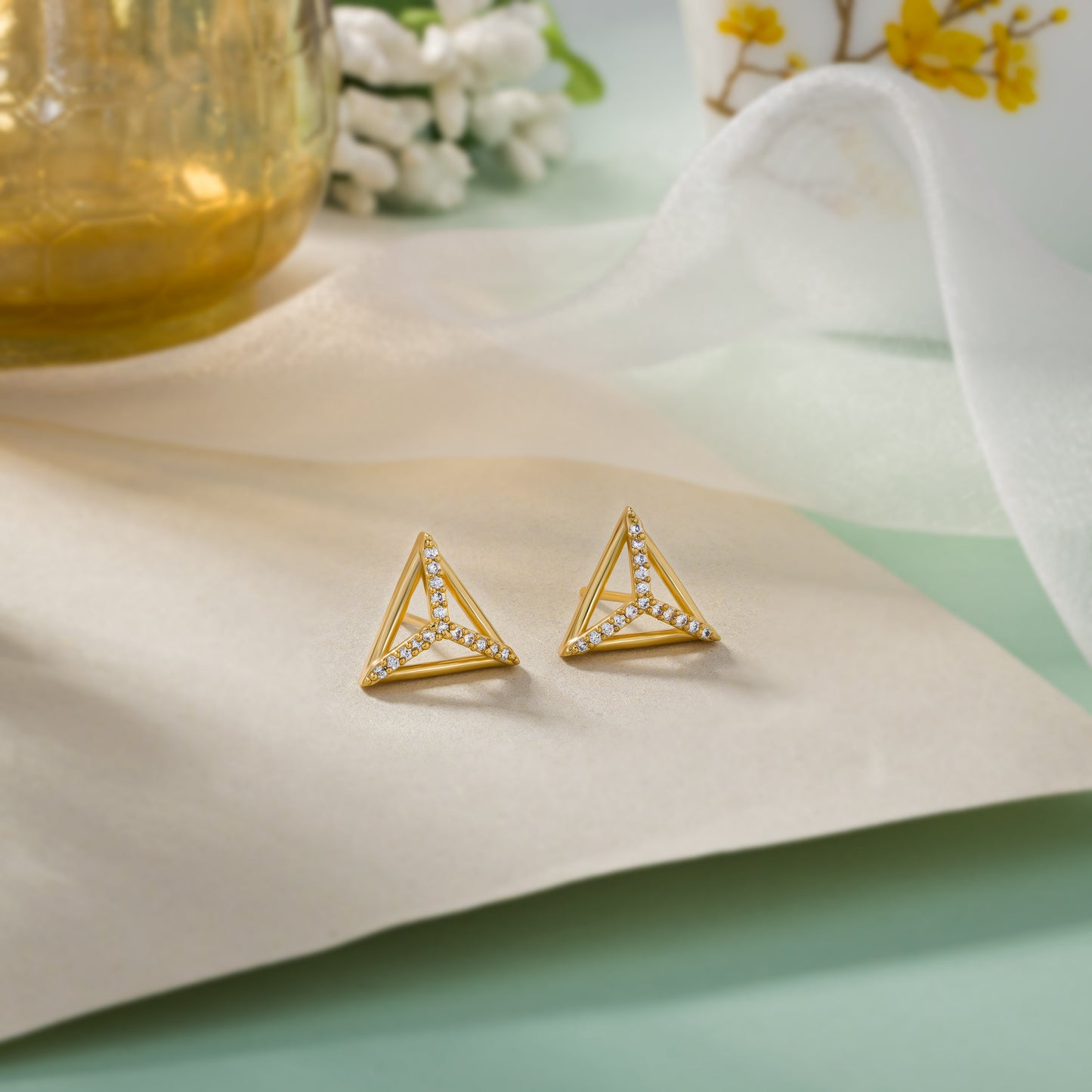 pair of golden earrings with diamonds