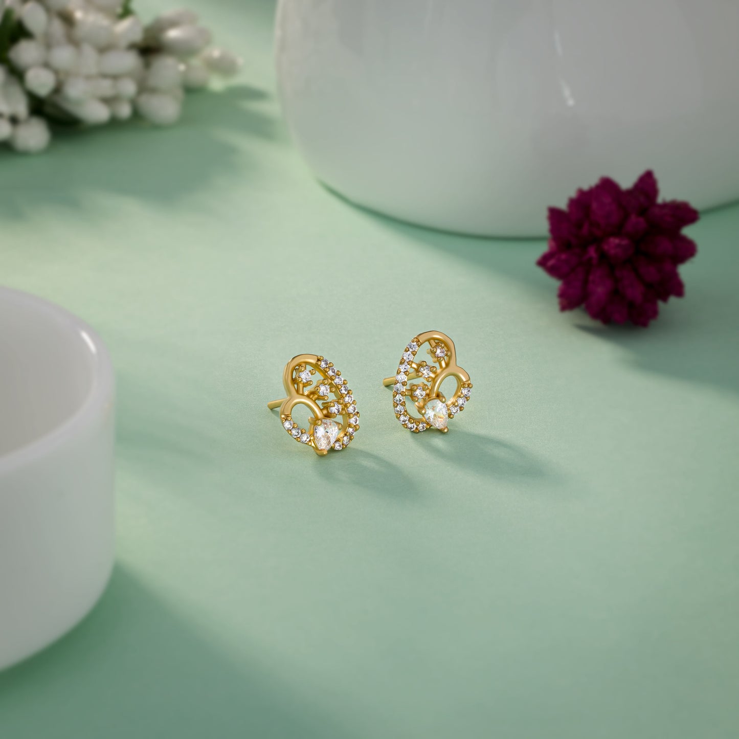 pair of golden earrings with diamonds