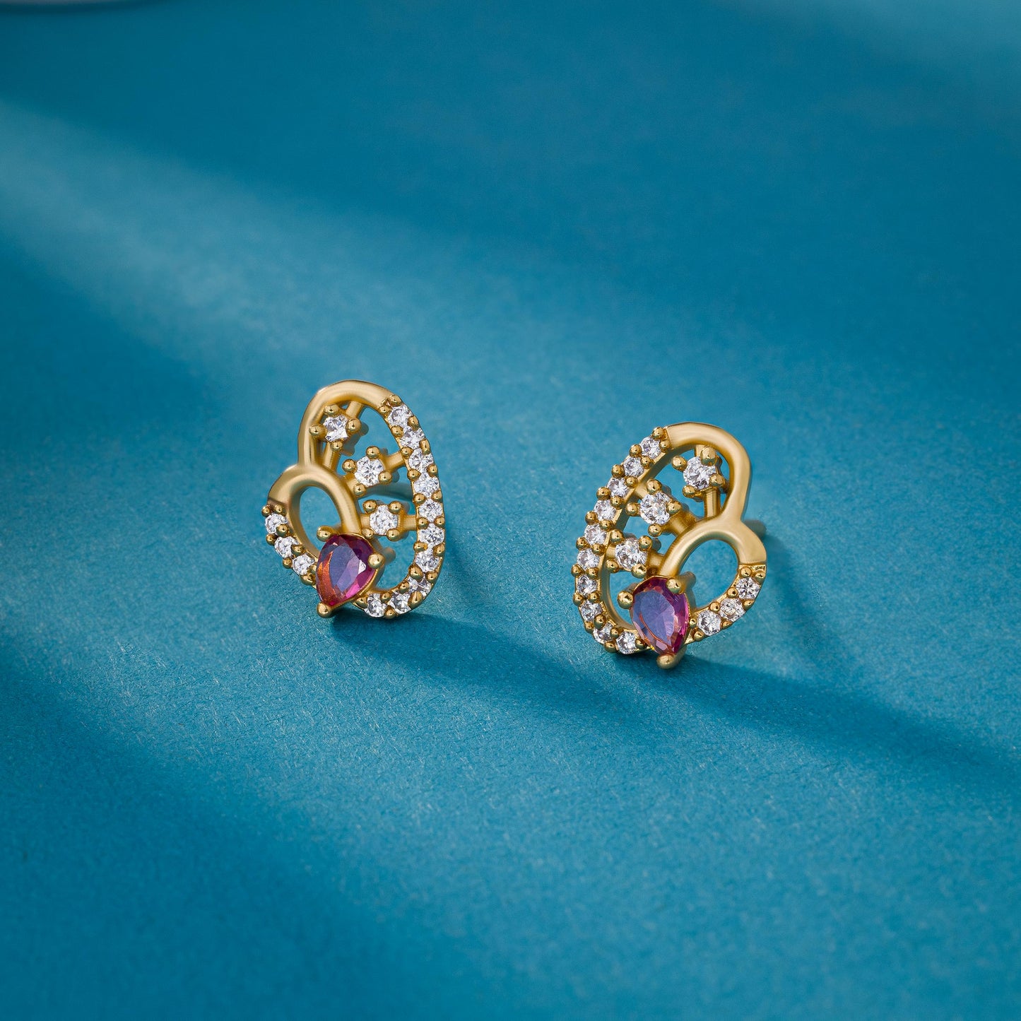 pair of golden earrings with diamonds