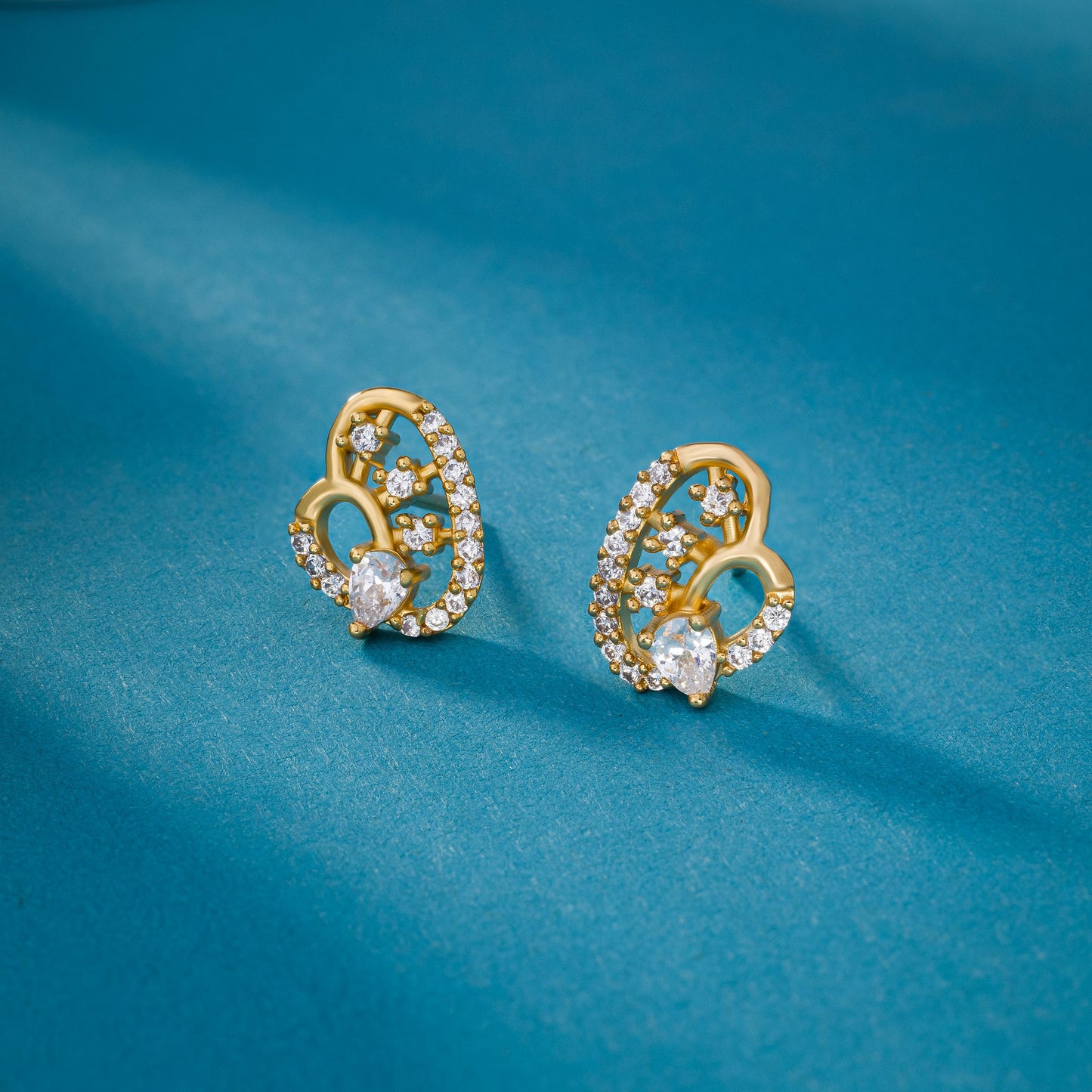 pair of golden earrings with diamonds