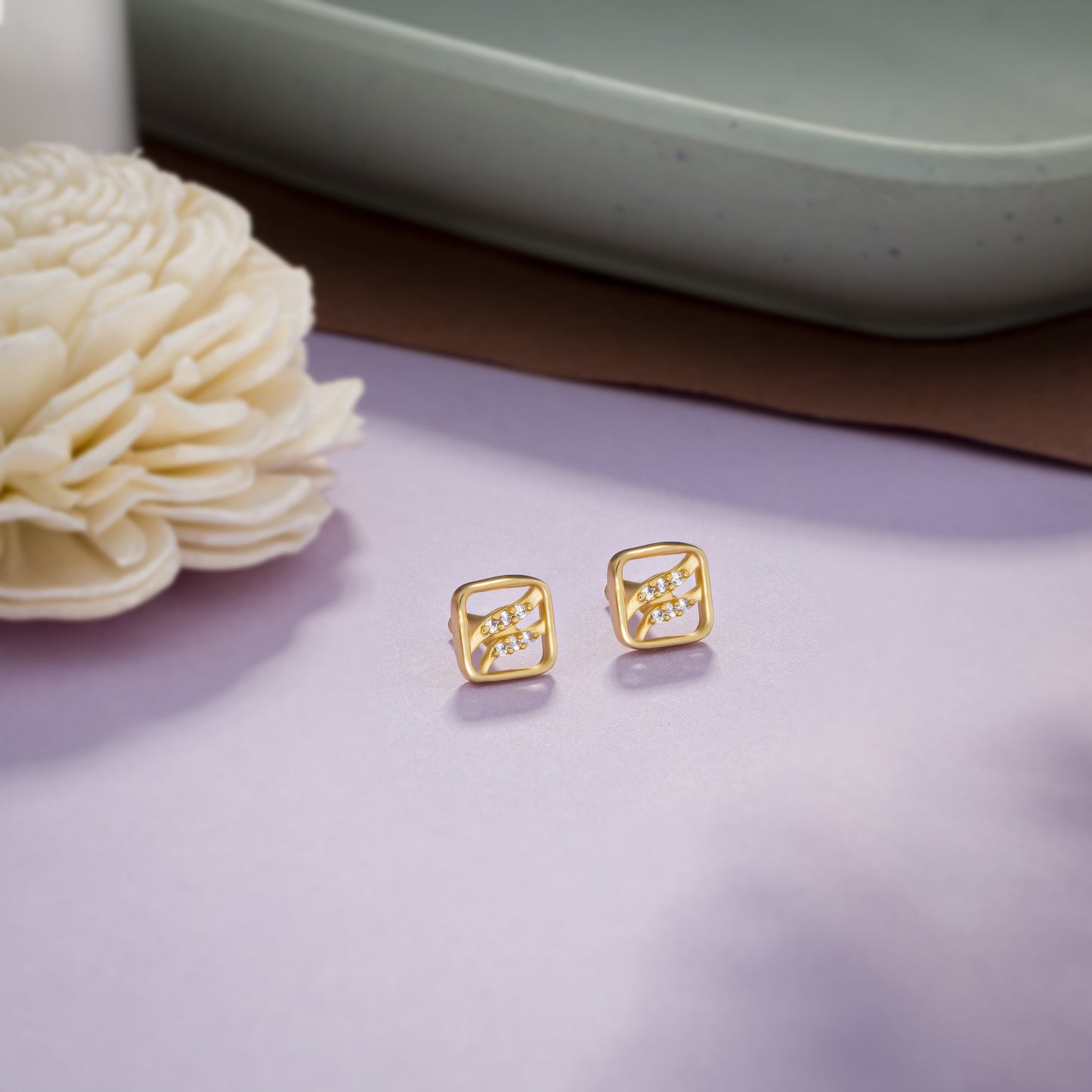 pair of golden earrings with diamonds