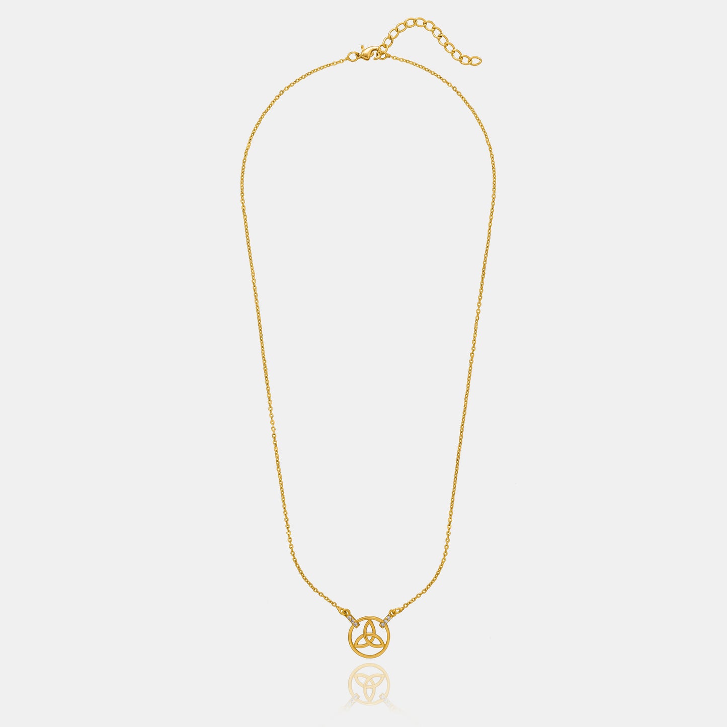 golden necklace with a small diamond on the front