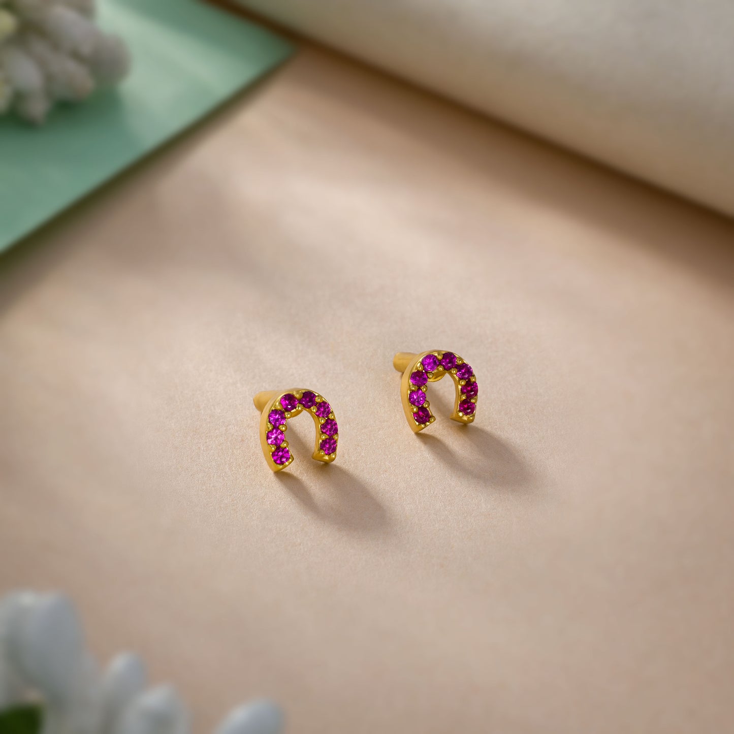 pair of golden earrings with diamonds