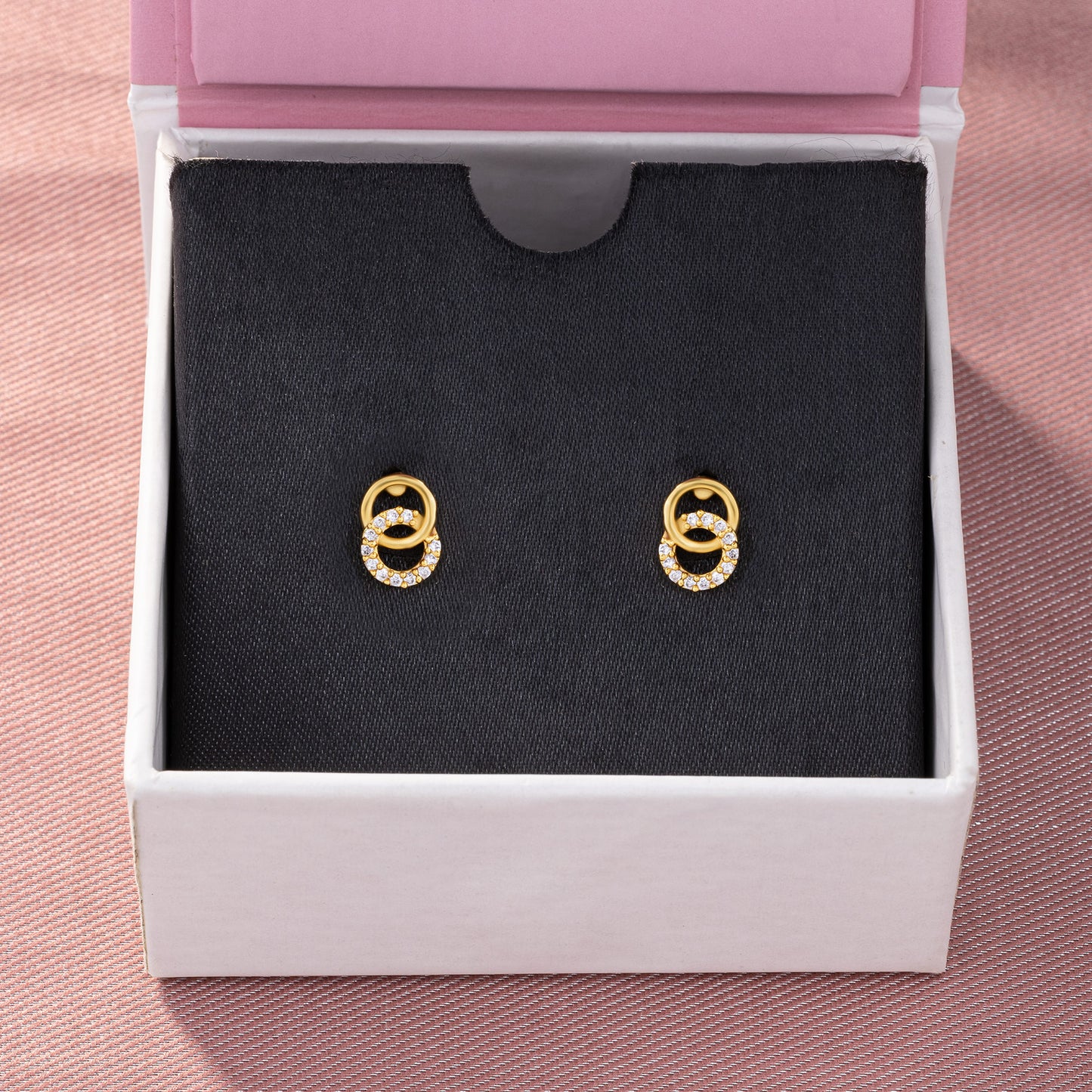 pair of golden earrings with diamonds