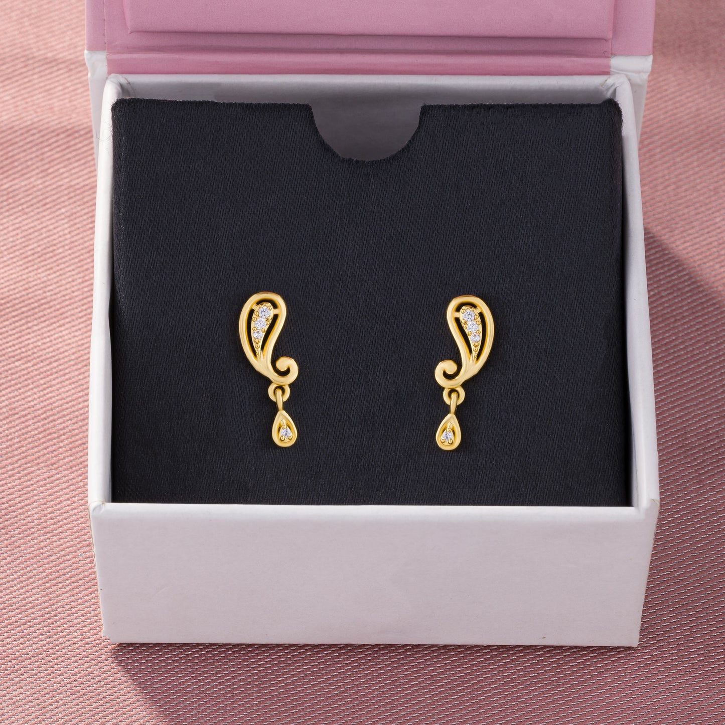 pair of golden earrings with diamonds