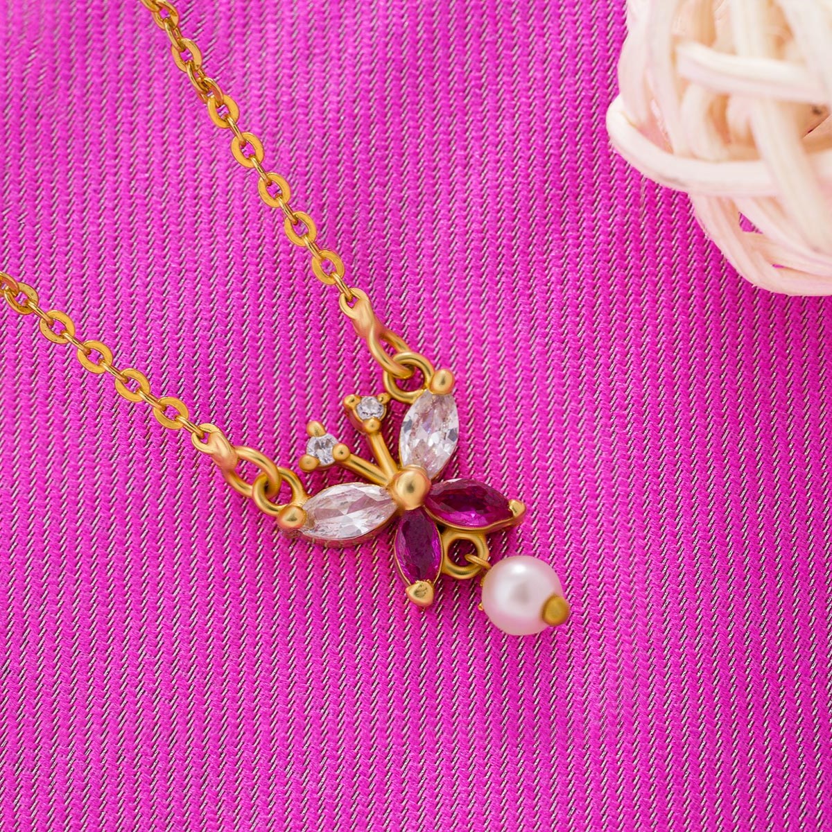 golden necklace with a butterfly pendant