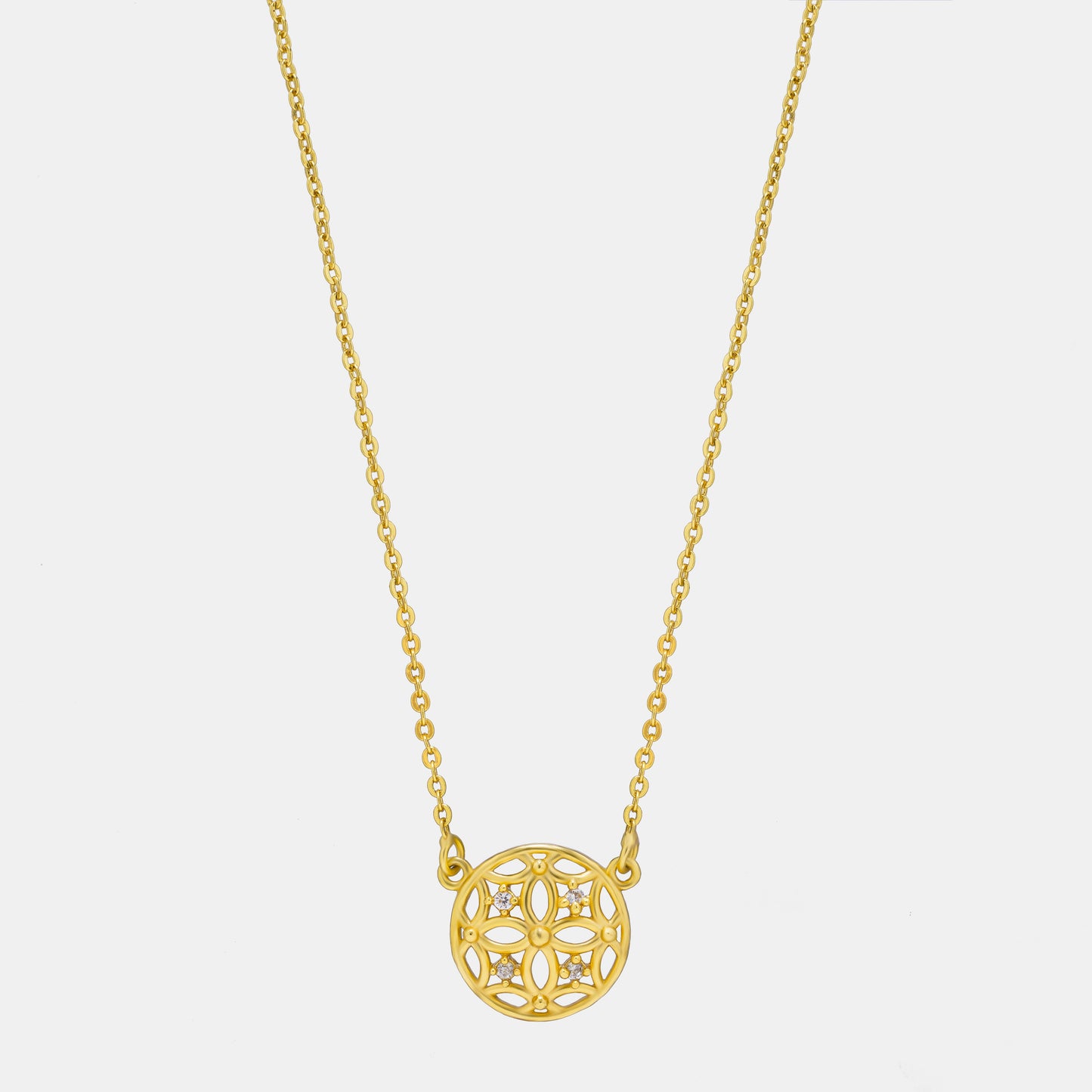 golden necklace with a small diamond on the front