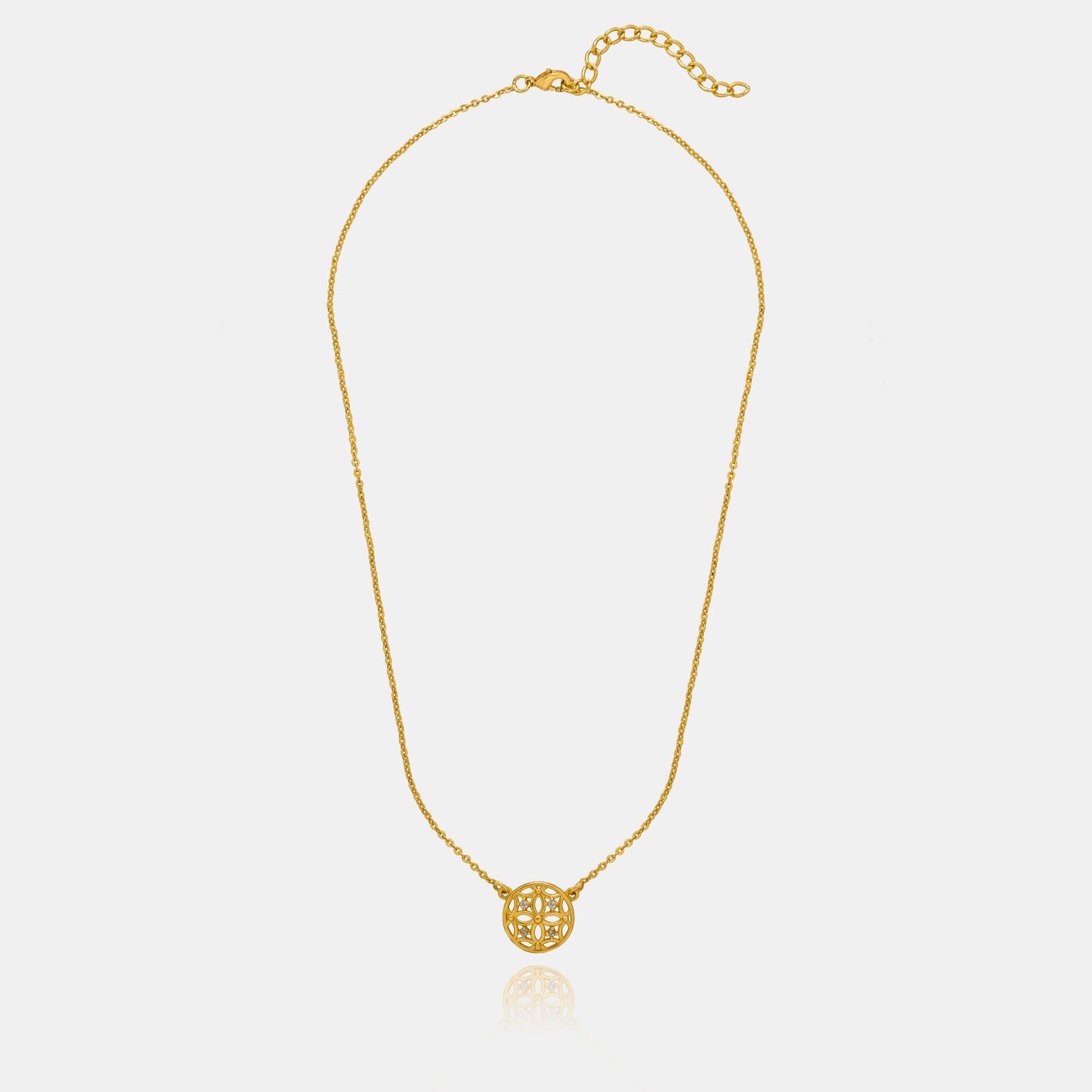 golden necklace with a small diamond on the front