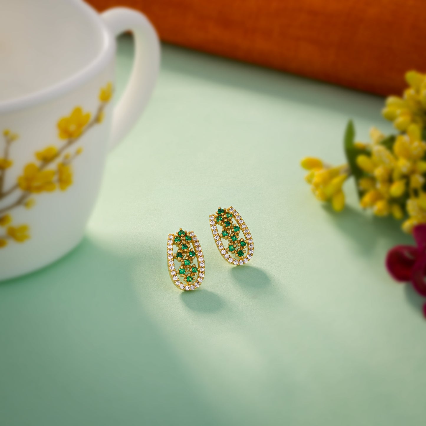 pair of emerald and diamond earrings