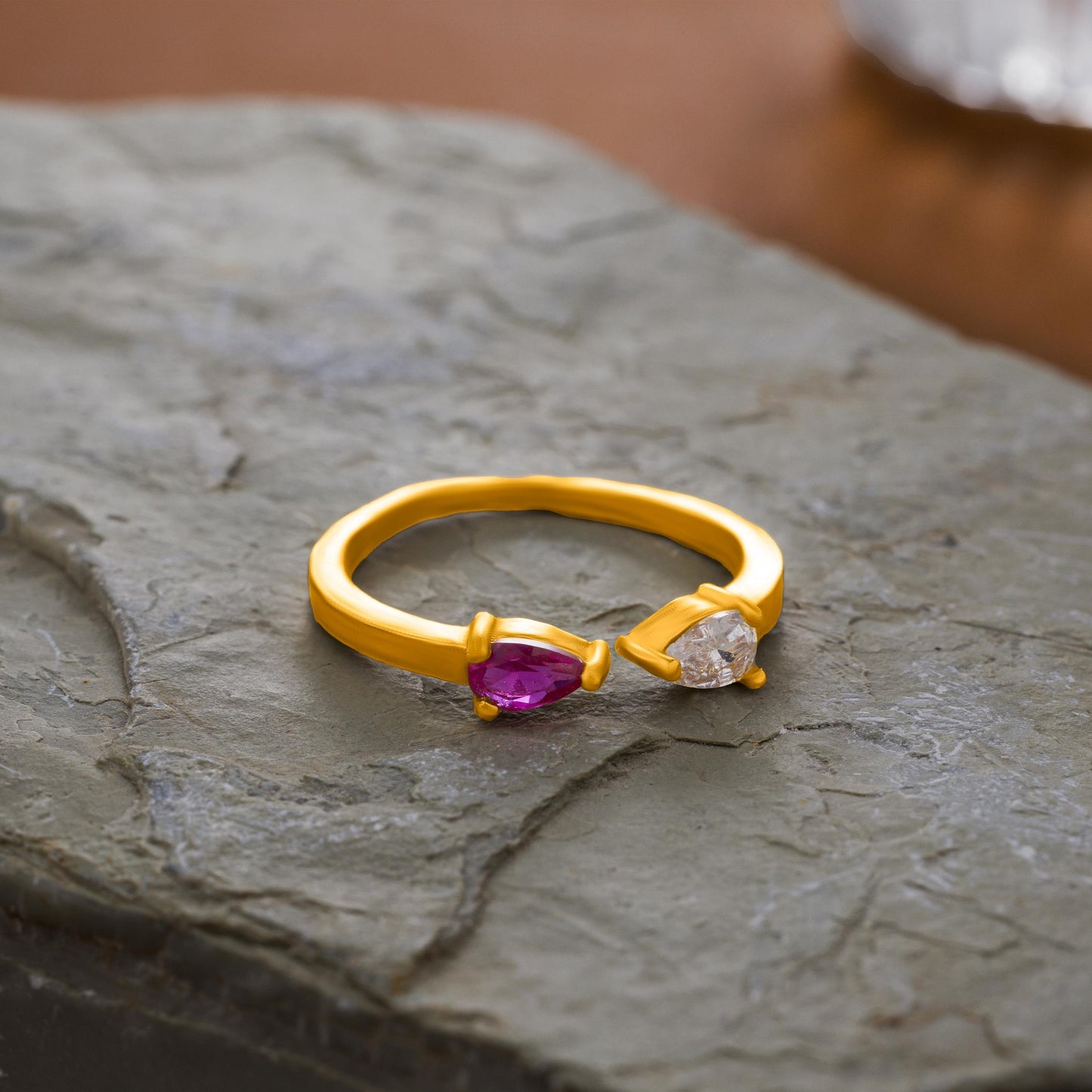 golden ring with a stone and a diamond