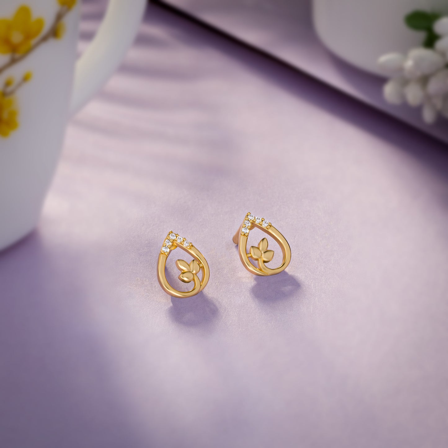 pair of golden earrings with diamonds