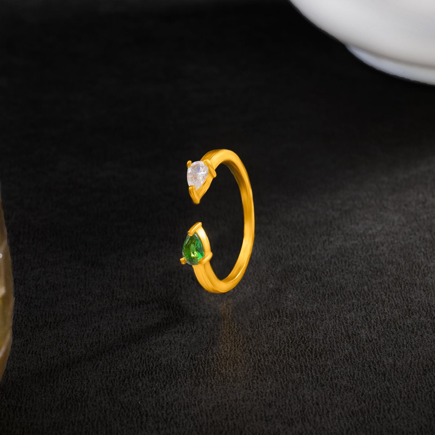 golden ring with a stone and a diamond