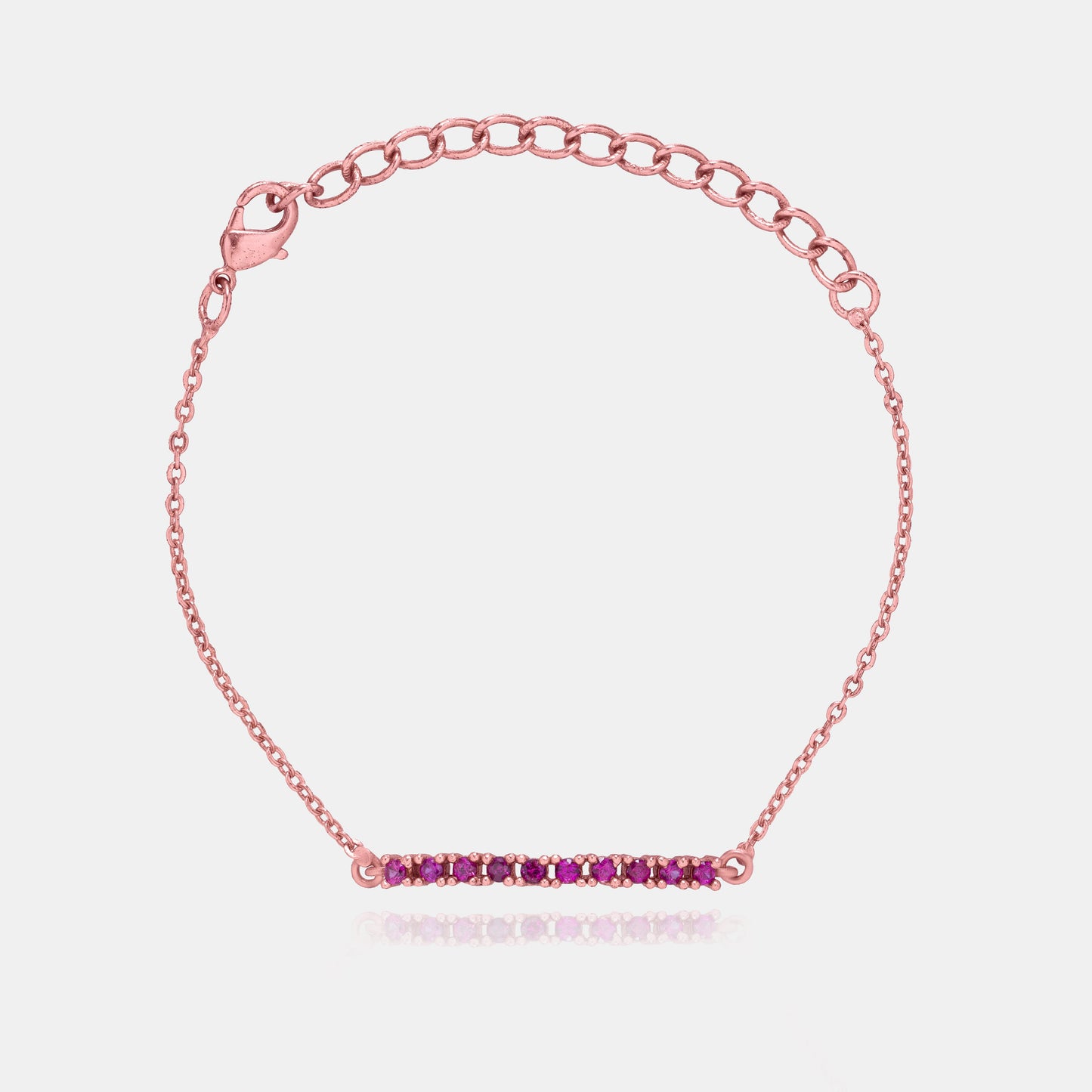 rose gold bracelet with a pink stone charm