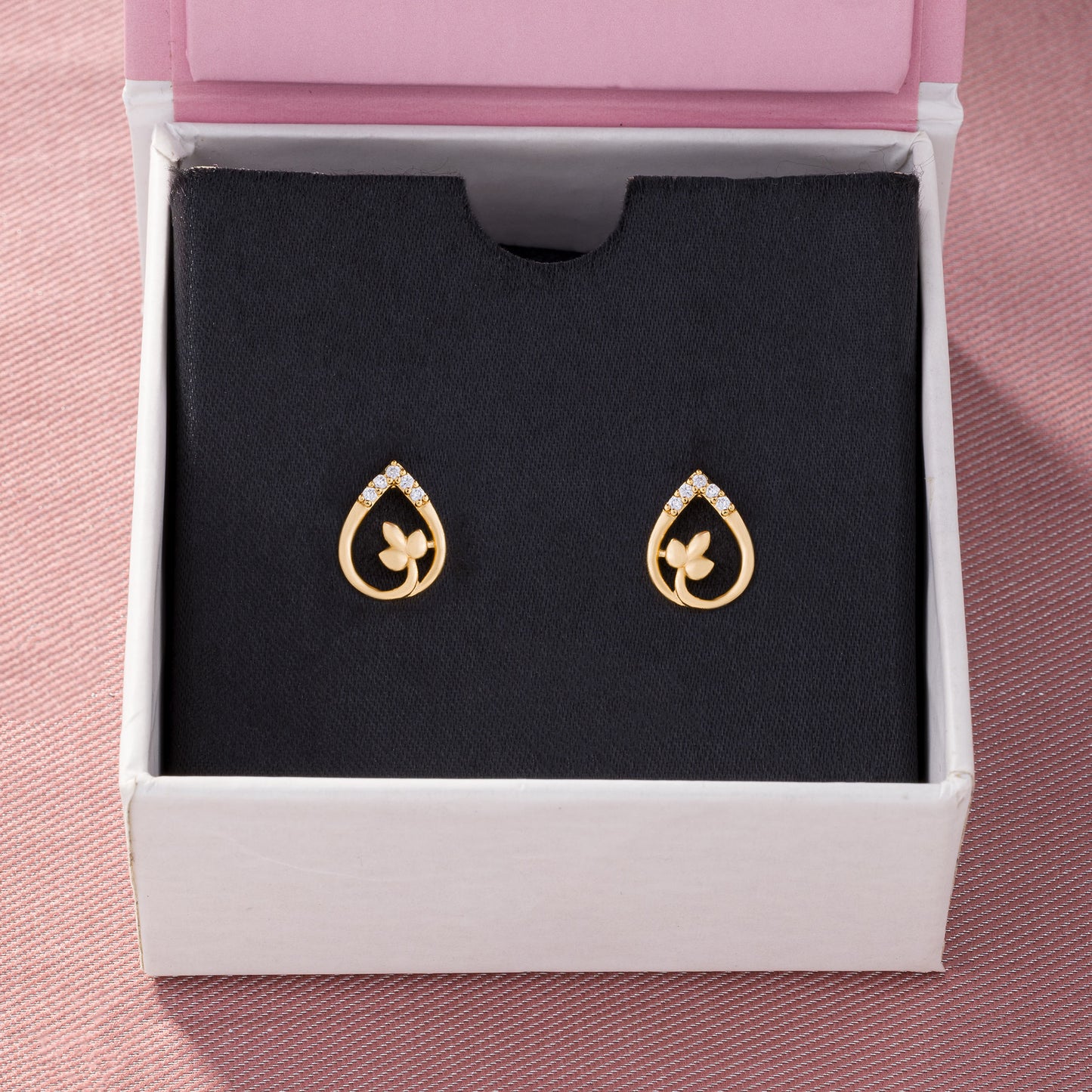 pair of golden earrings with diamonds