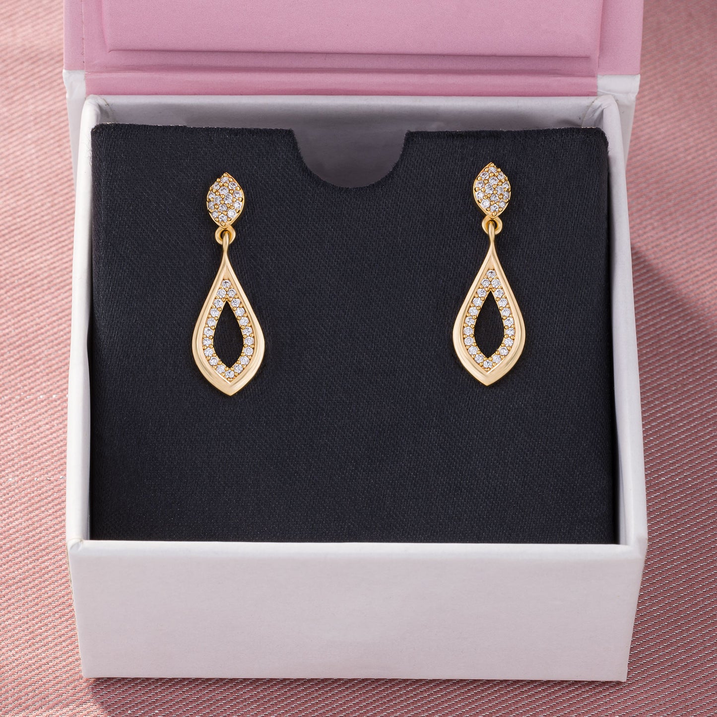 pair of golden earrings with diamonds