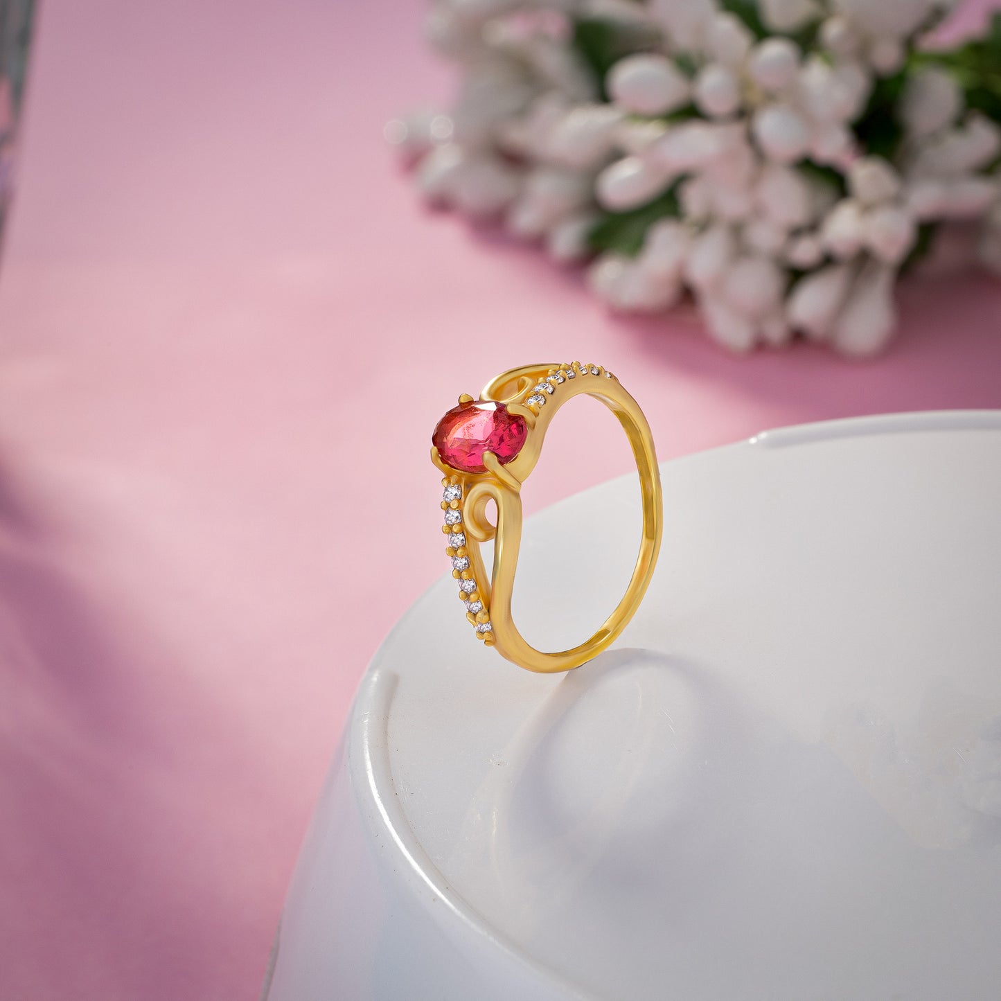 golden ring with a tourmal stone and diamonds