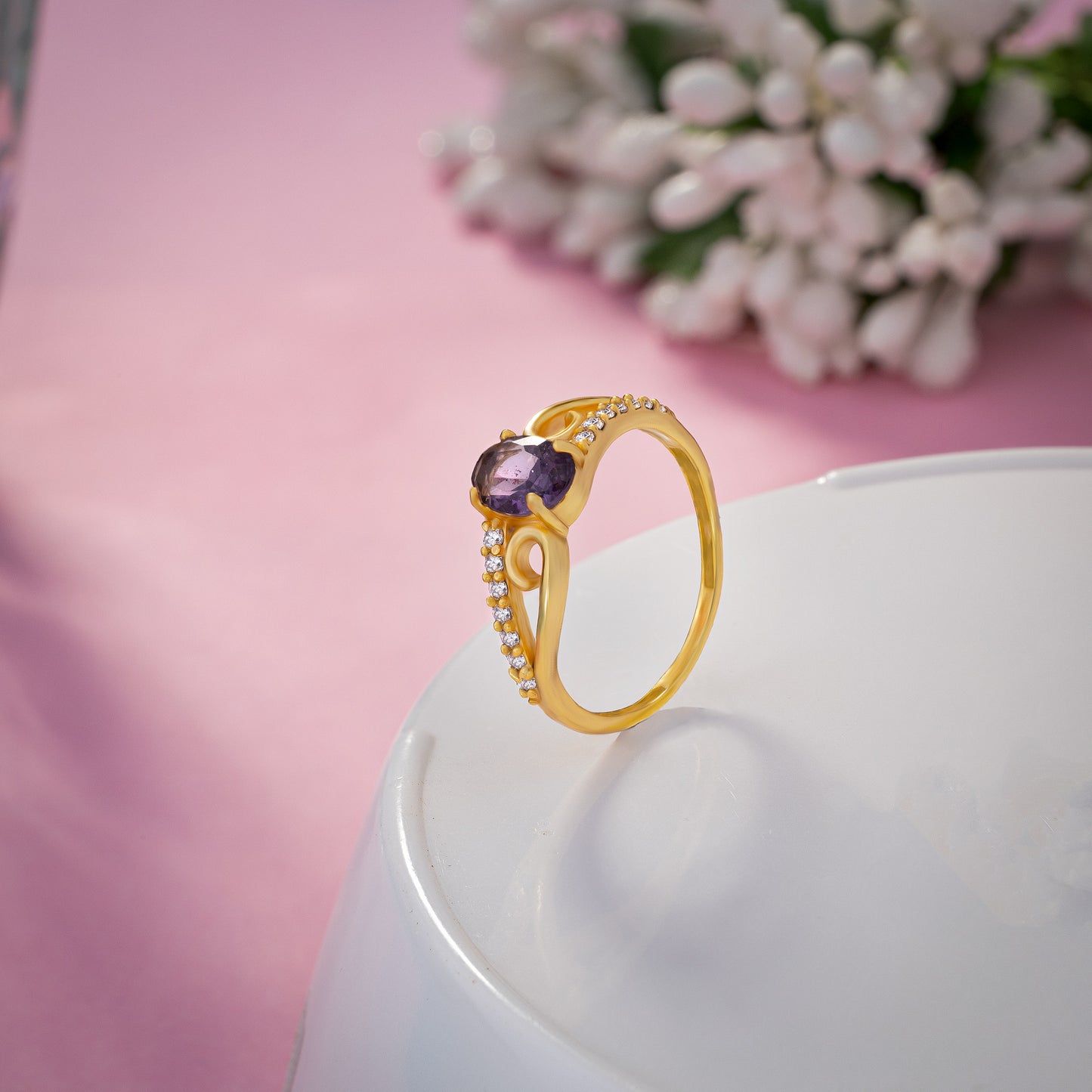 golden ring with a tourmal stone and diamonds