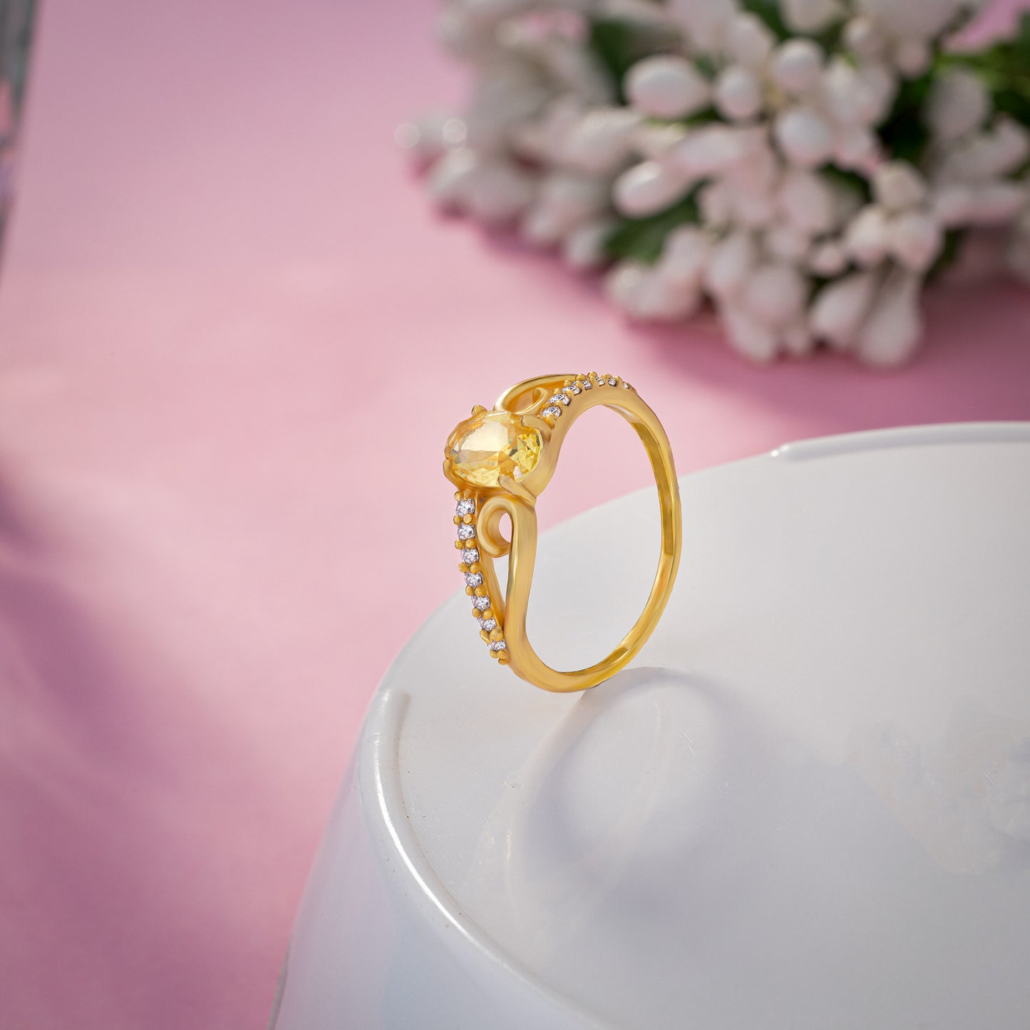 golden ring with a tourmal stone and diamonds