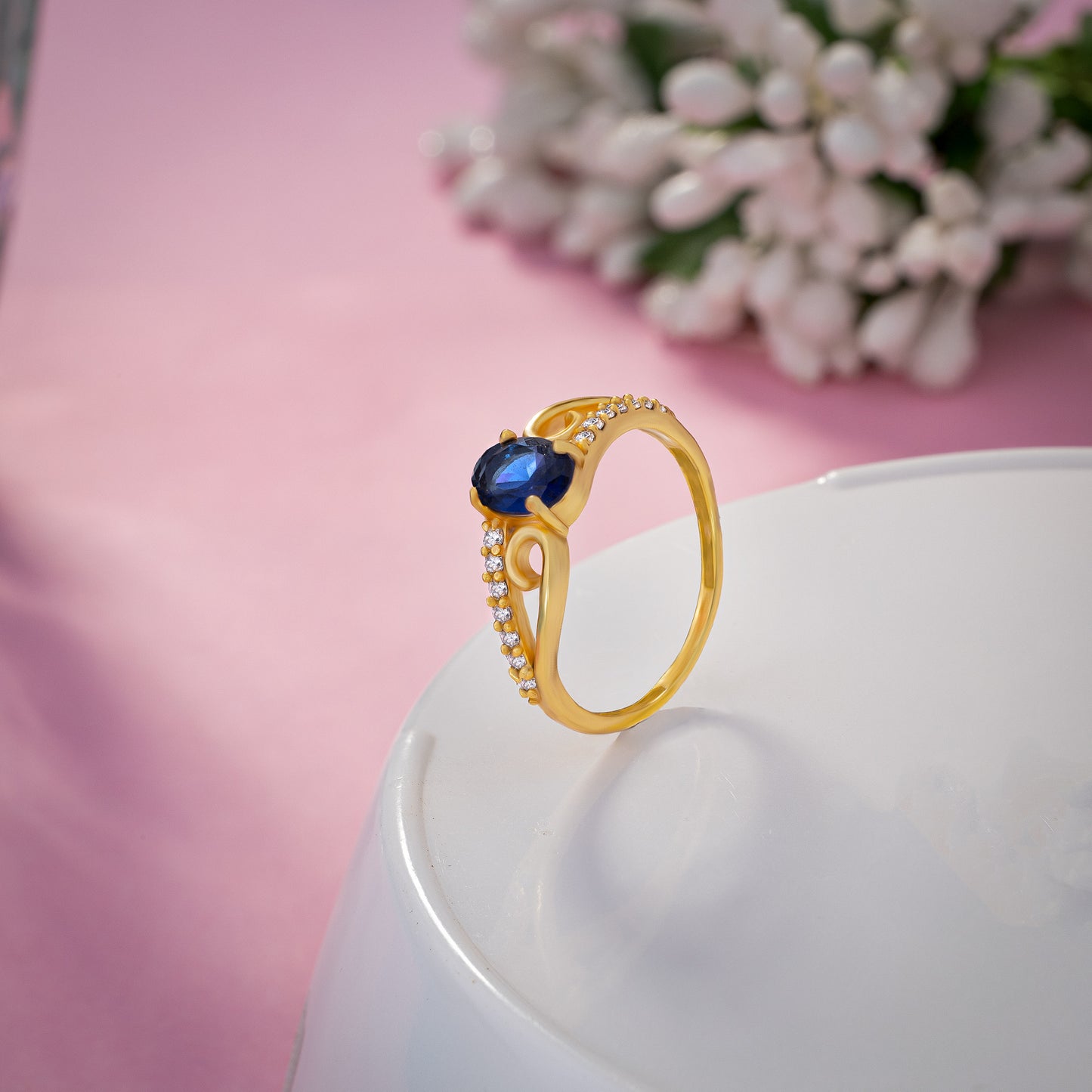 golden ring with a tourmal stone and diamonds