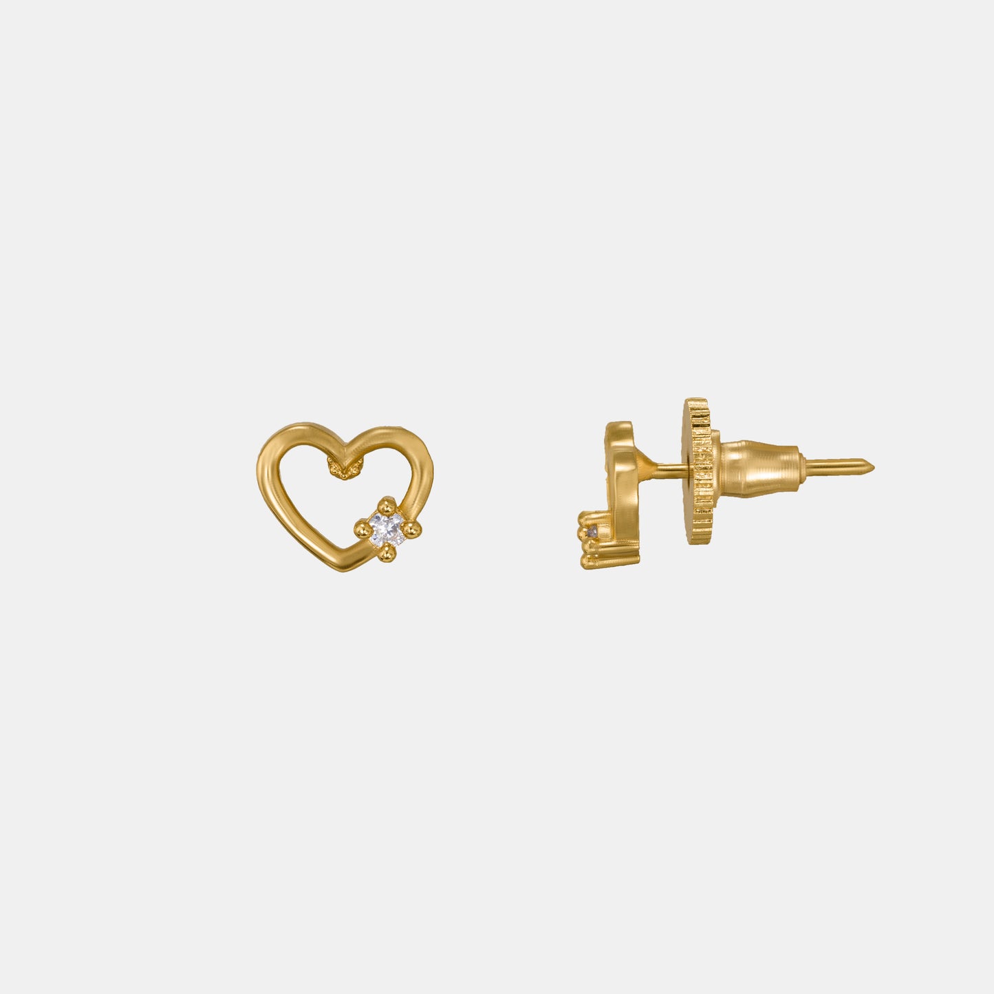 pair of golden earrings with a heart shaped diamond