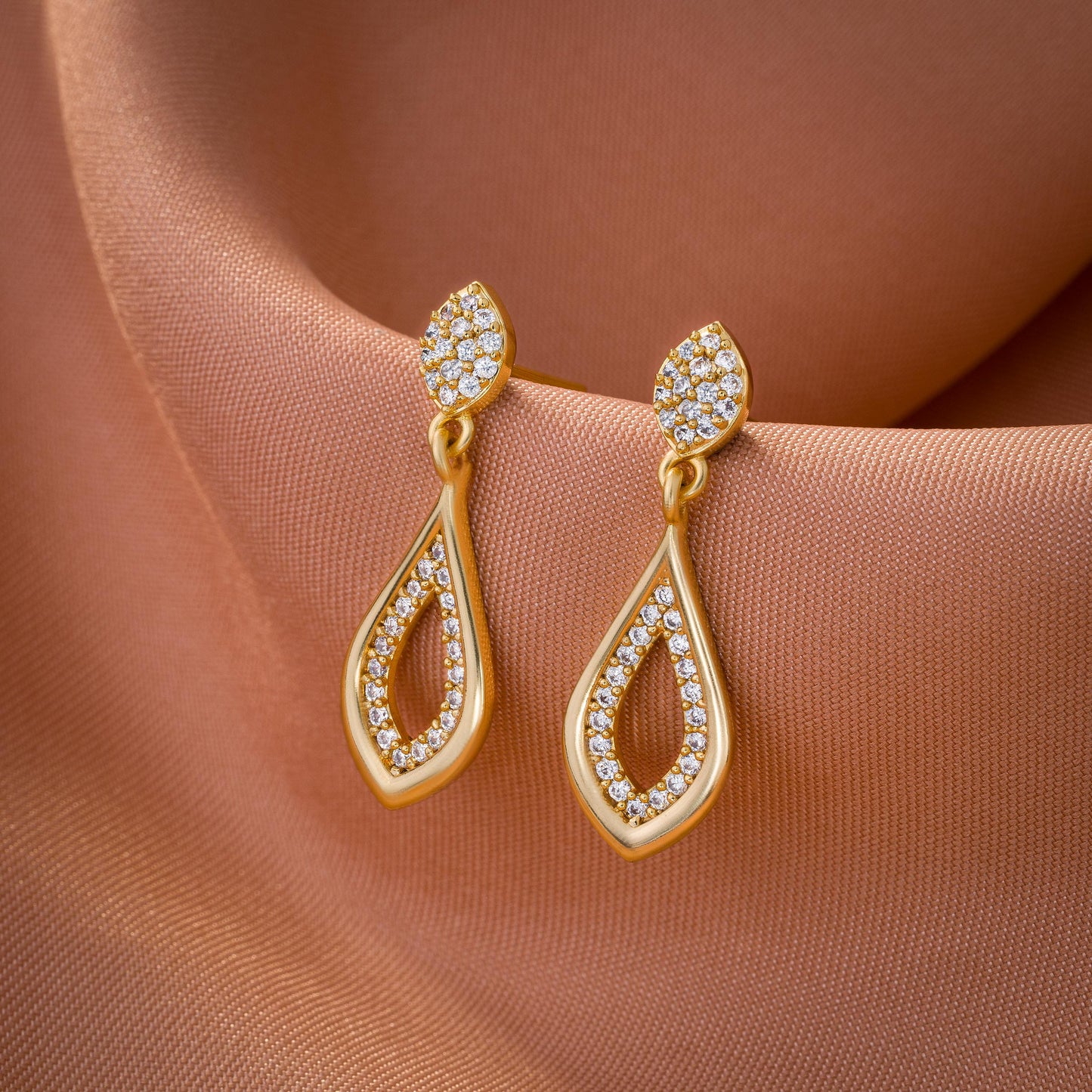 pair of golden earrings with diamonds