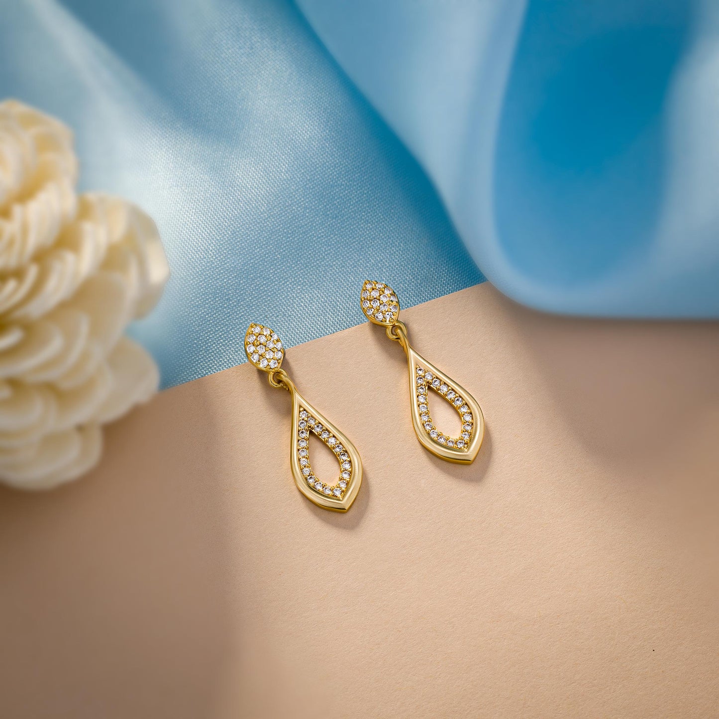 pair of golden earrings with diamonds