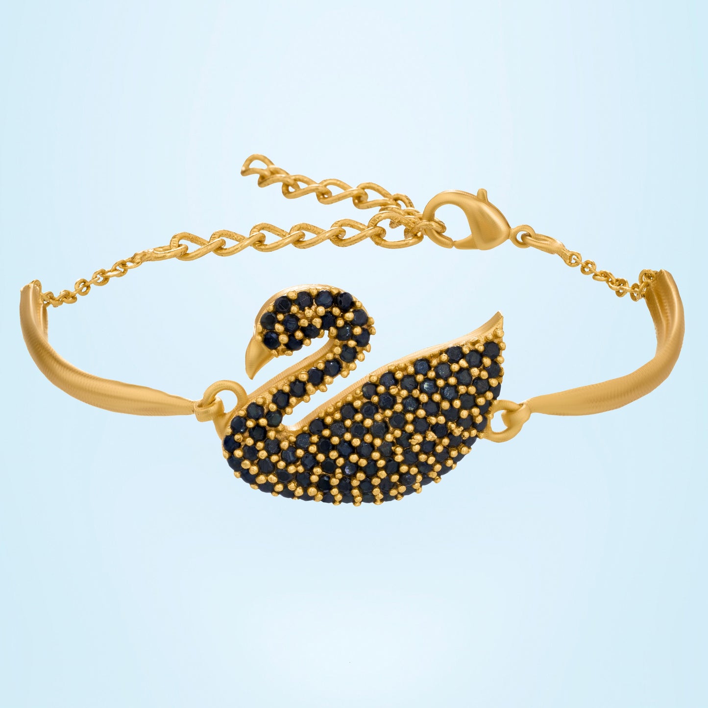 golden bracelet with a swan on it