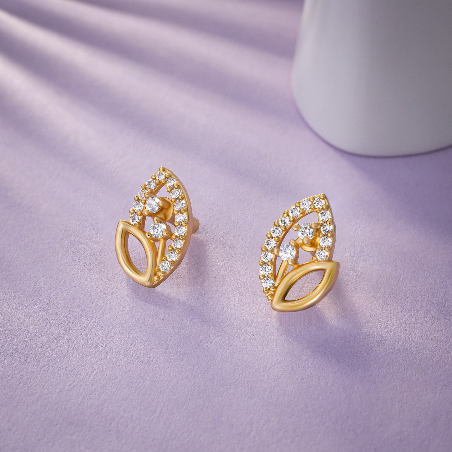 pair of golden earrings with diamonds