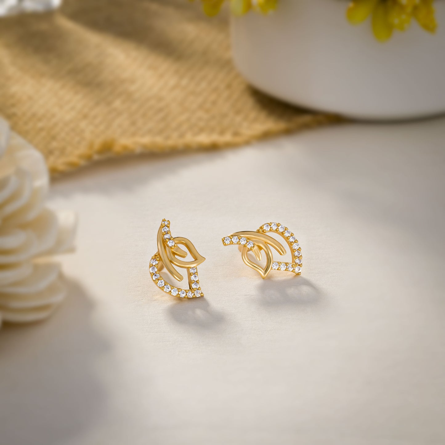 pair of golden earrings with diamonds