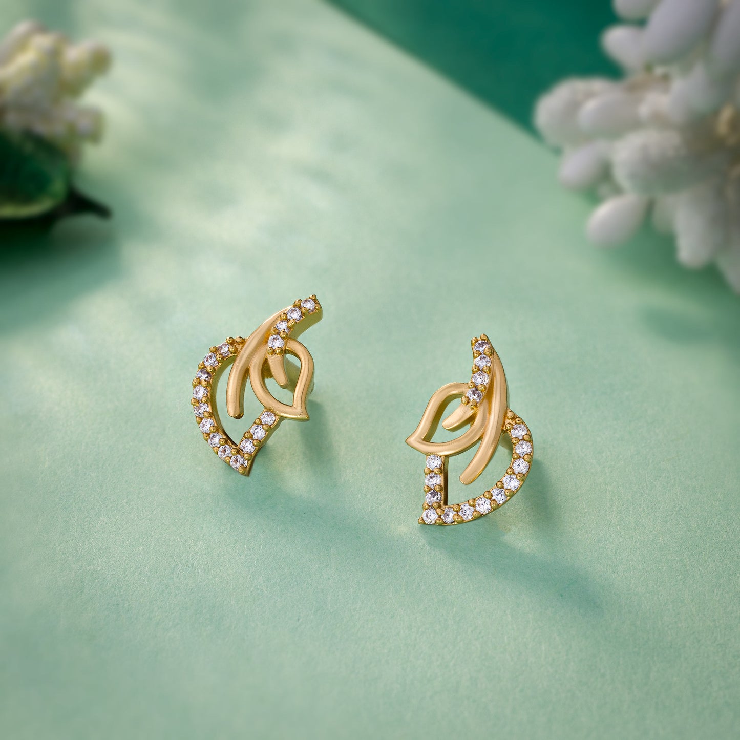 pair of golden earrings with diamonds