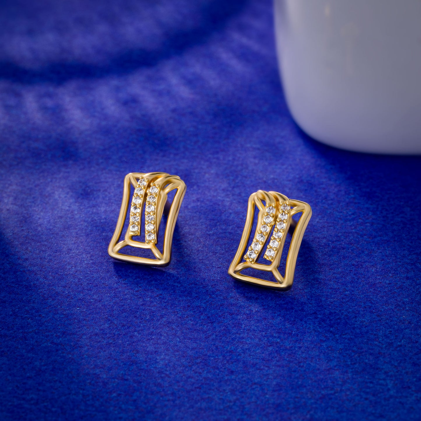 pair of golden earrings with diamonds