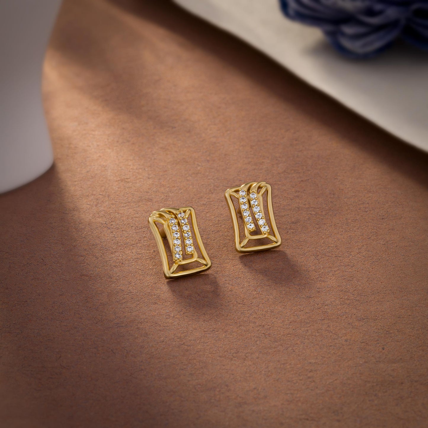 pair of golden earrings with diamonds